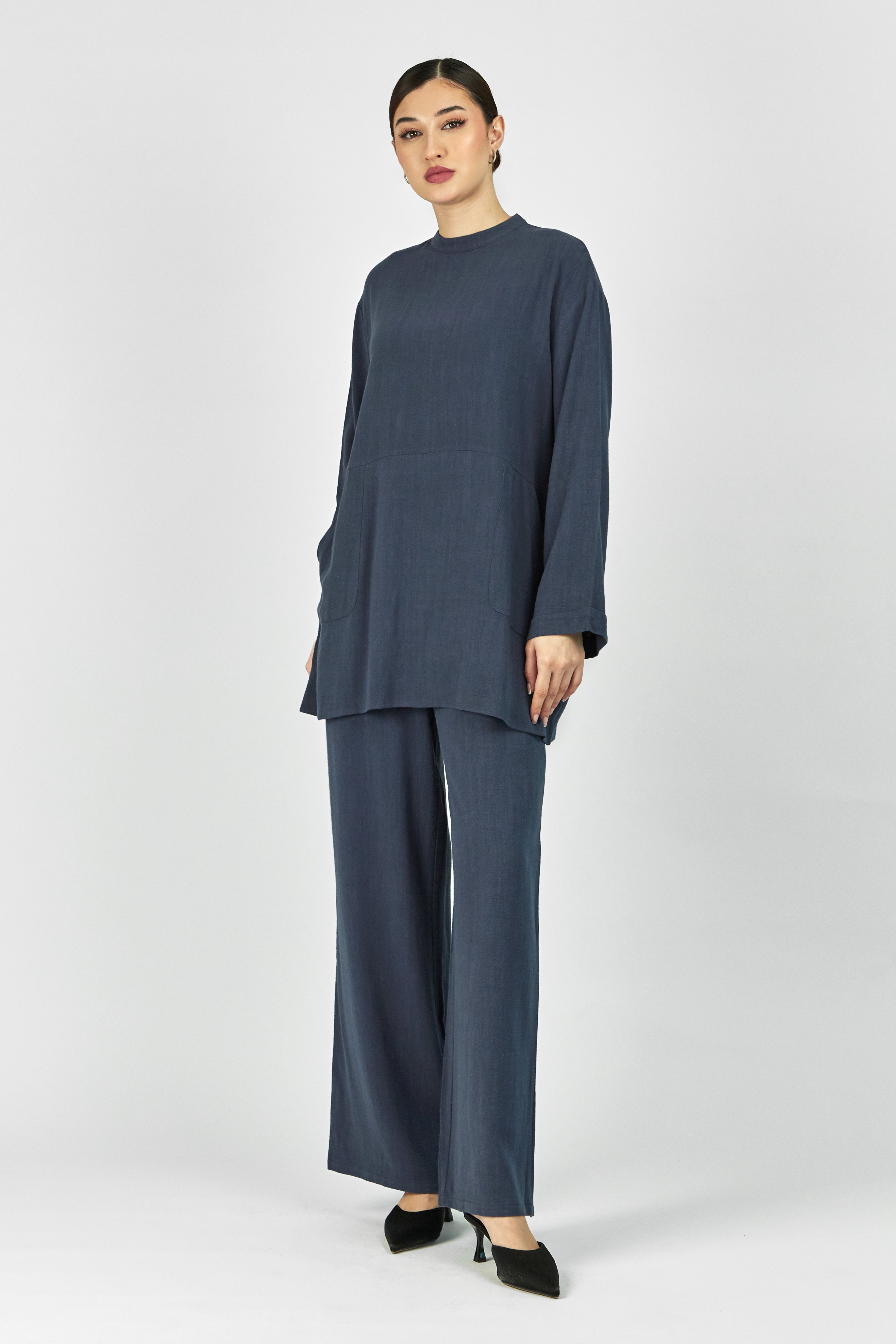 Colour: Royal Blue. A woman posing in a Linen Blend Top.