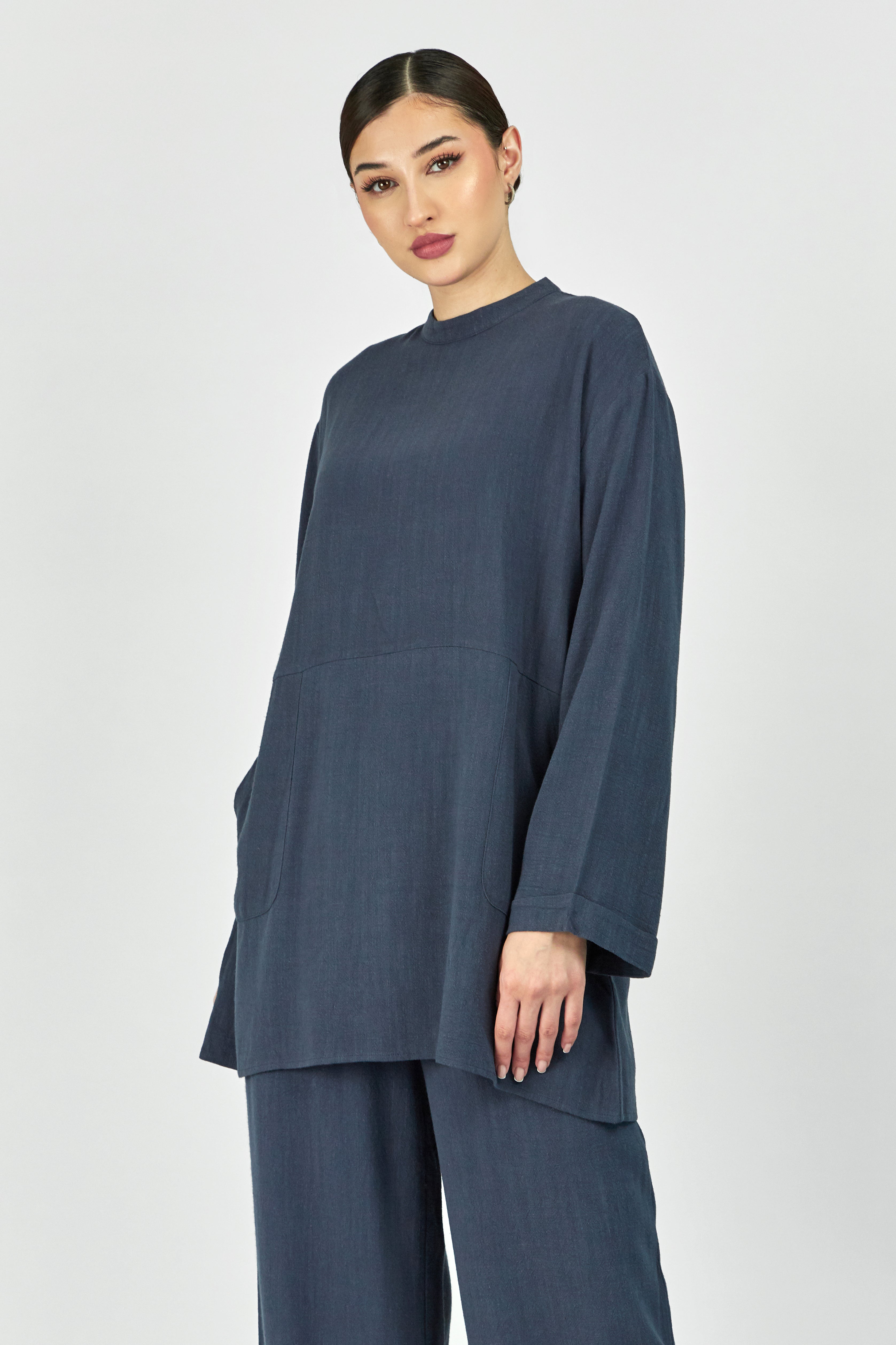 Colour: Royal Blue. A girl is facing the camera in a Linen Blend Top.