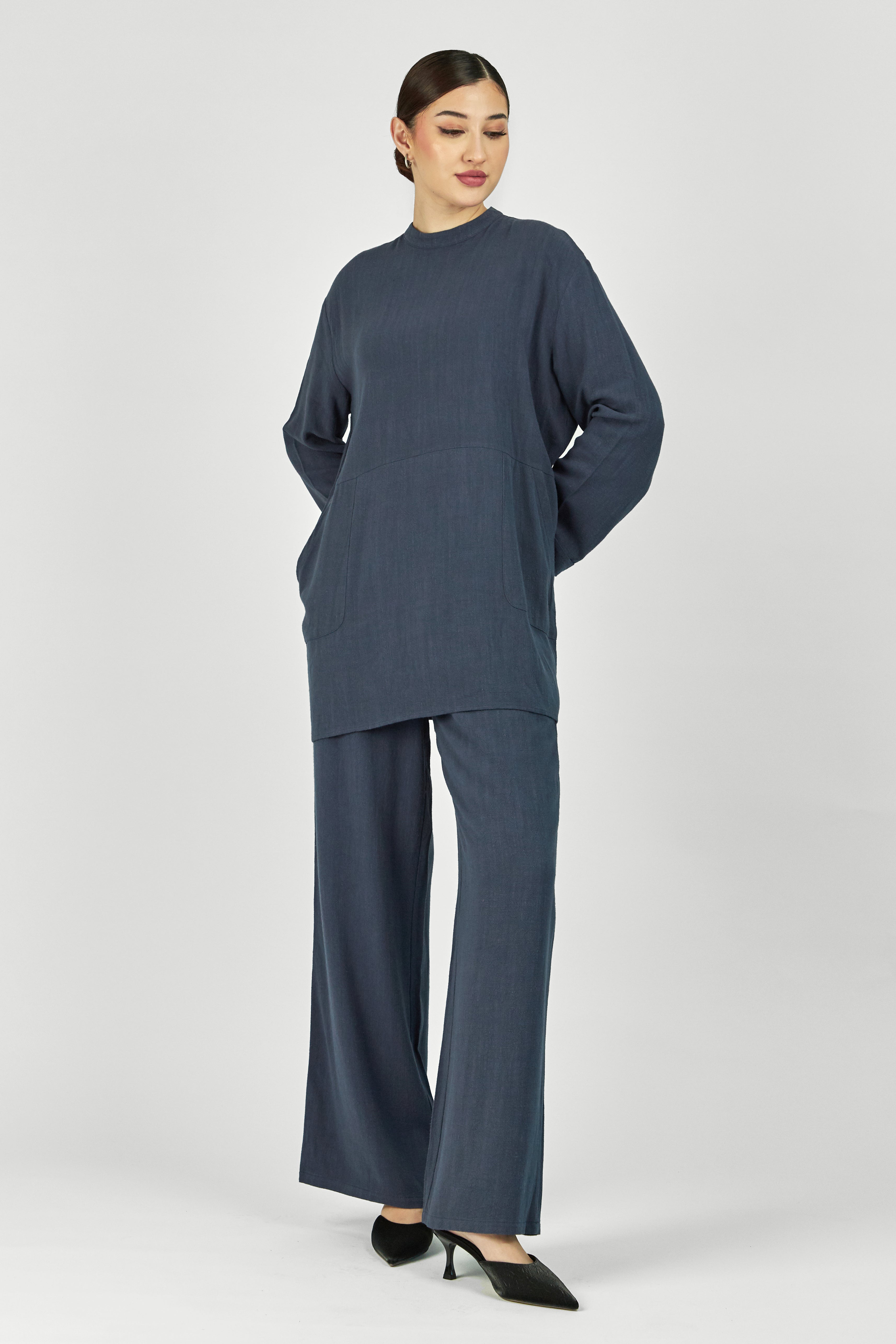 Colour: Royal Blue. A model with her hand in her pocket wearing a Linen Blend Top.