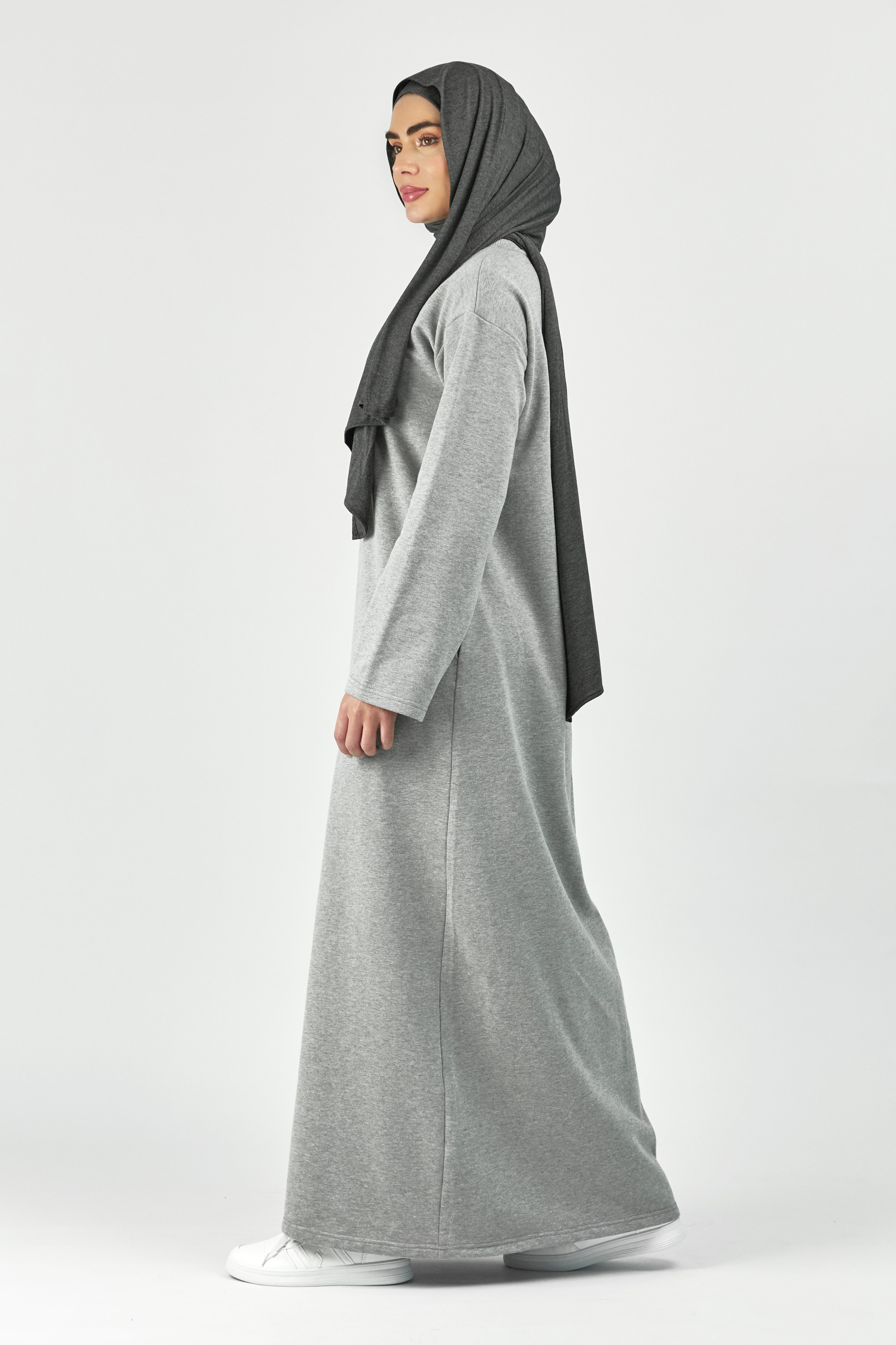 Colour: Grey. A girl is turned left in a wide sleeve sweatshirt dress.