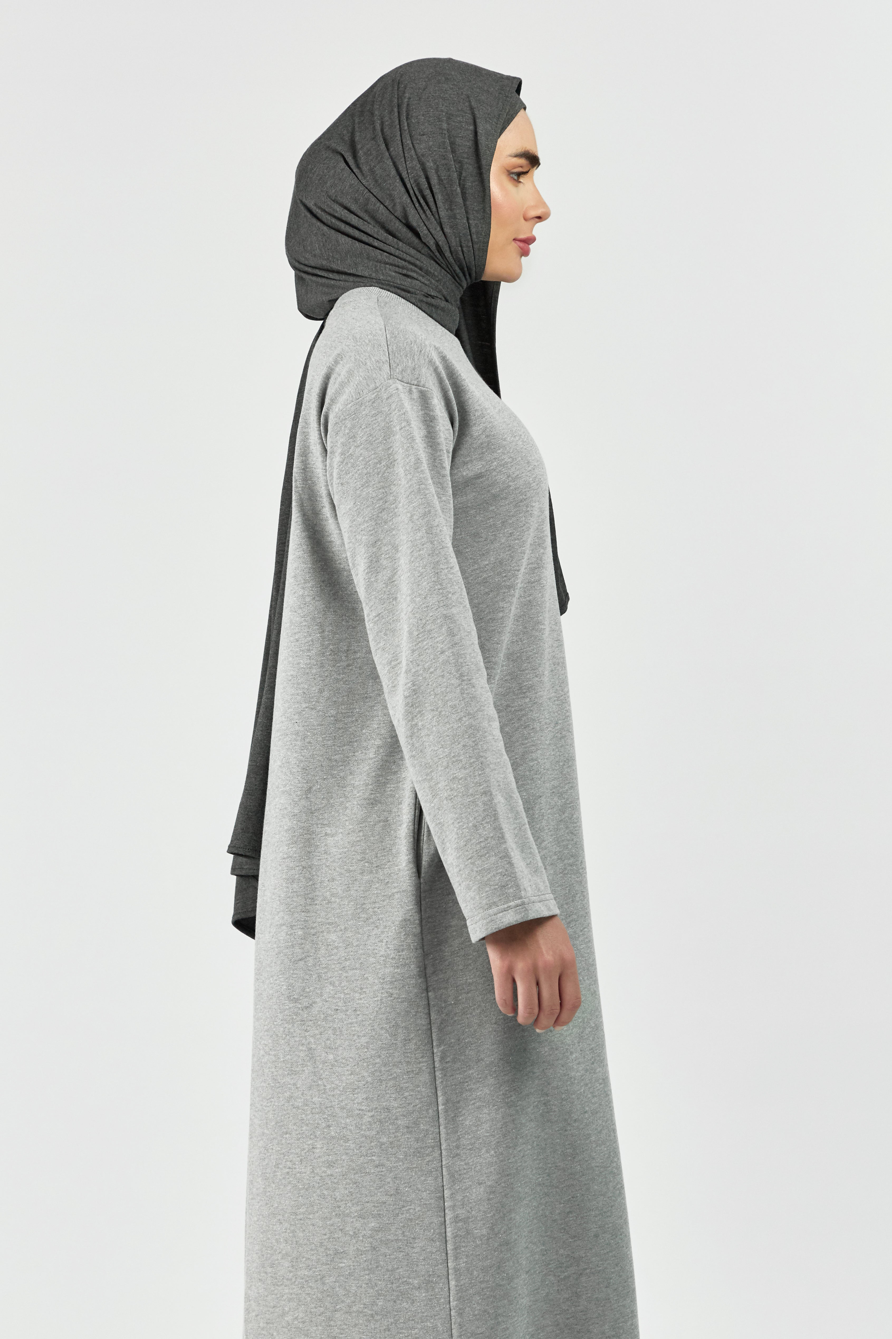 Colour: Grey. A model is turned right in a wide sleeve sweatshirt dress.