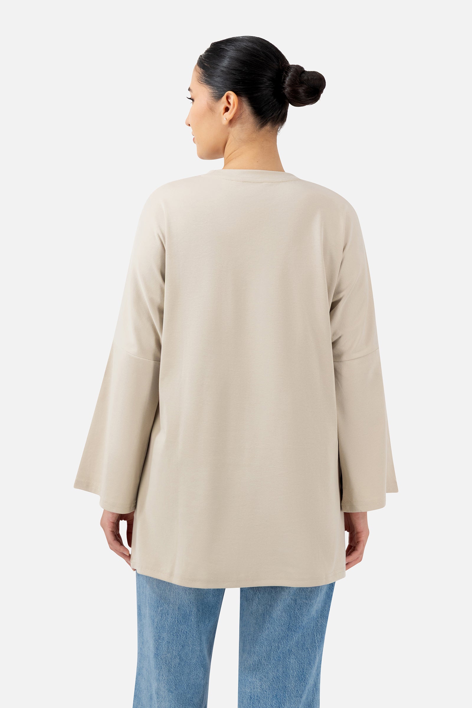Back view of the Mink oversized long-sleeve T-shirt showcasing the comfortable loose fit.