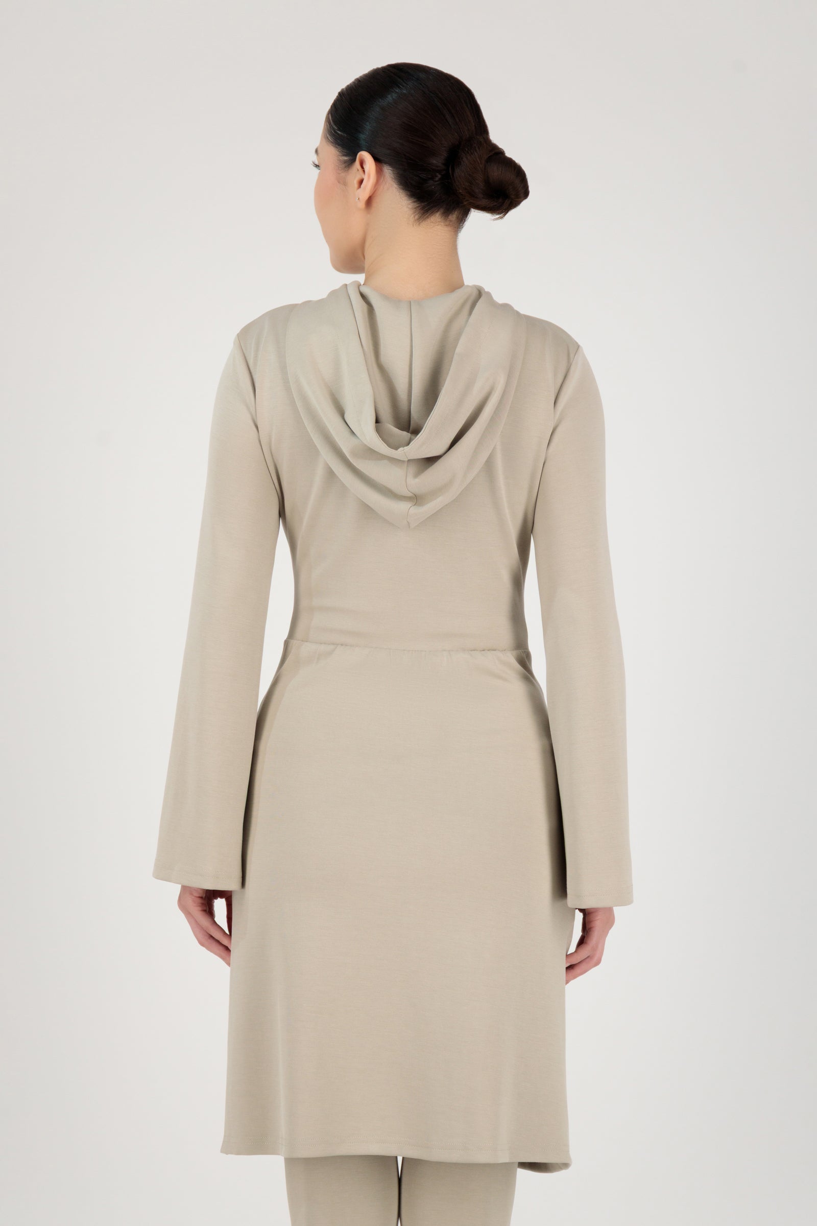 Back view of the FARES Buttery Gathered Waist Long Hoodie in Stone highlighting clean lines and a relaxed fit designed for everyday hoodies for women.