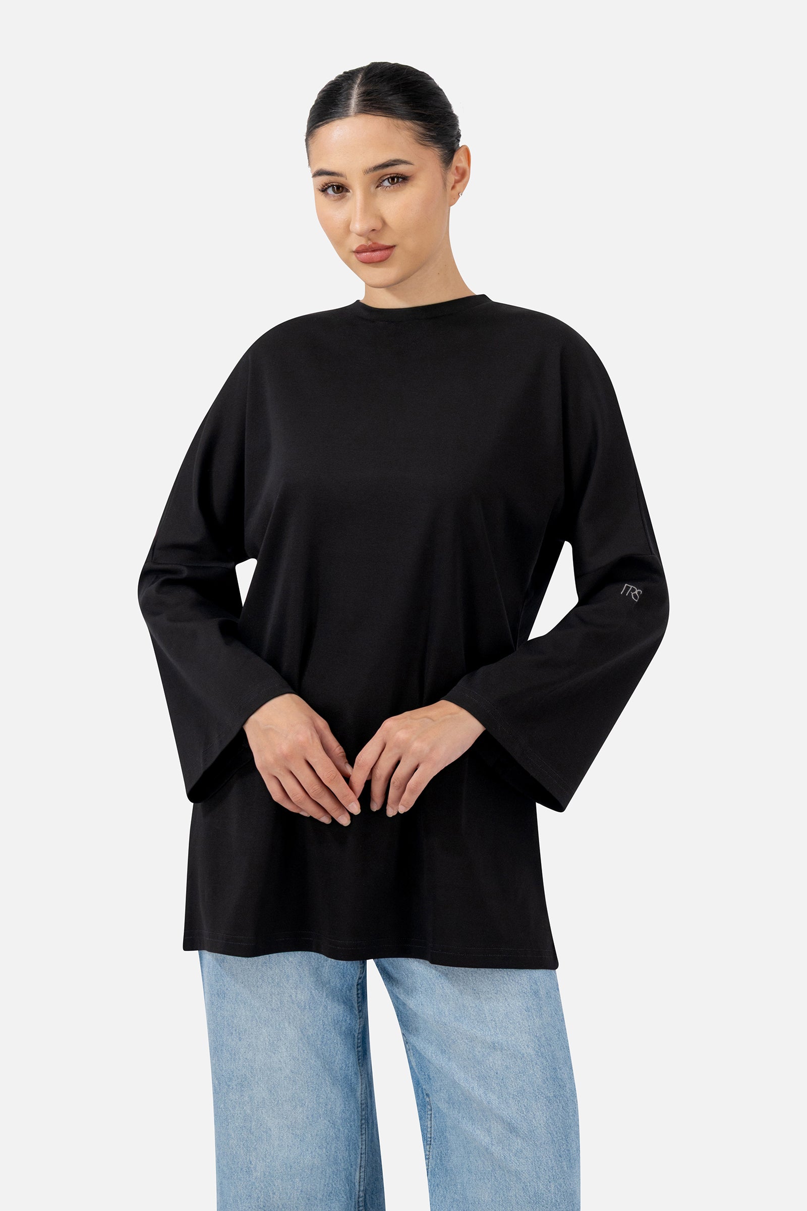 Front view of the Black Cotton Long-Sleeve Tee with an oversized fit and relaxed silhouette.