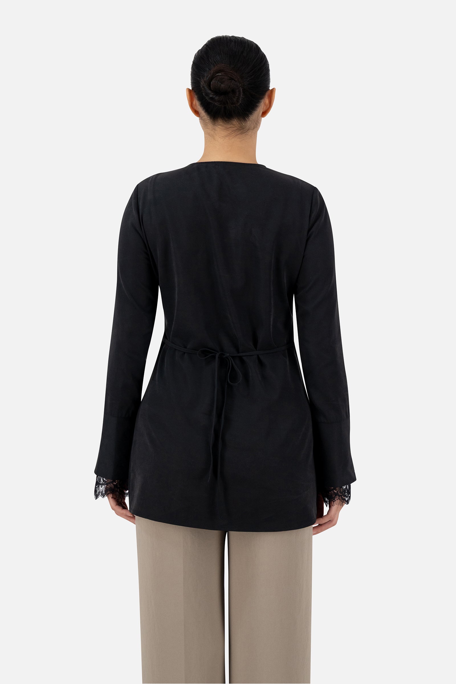 Back view of the Black button-up long-sleeve top showing the lace detail.