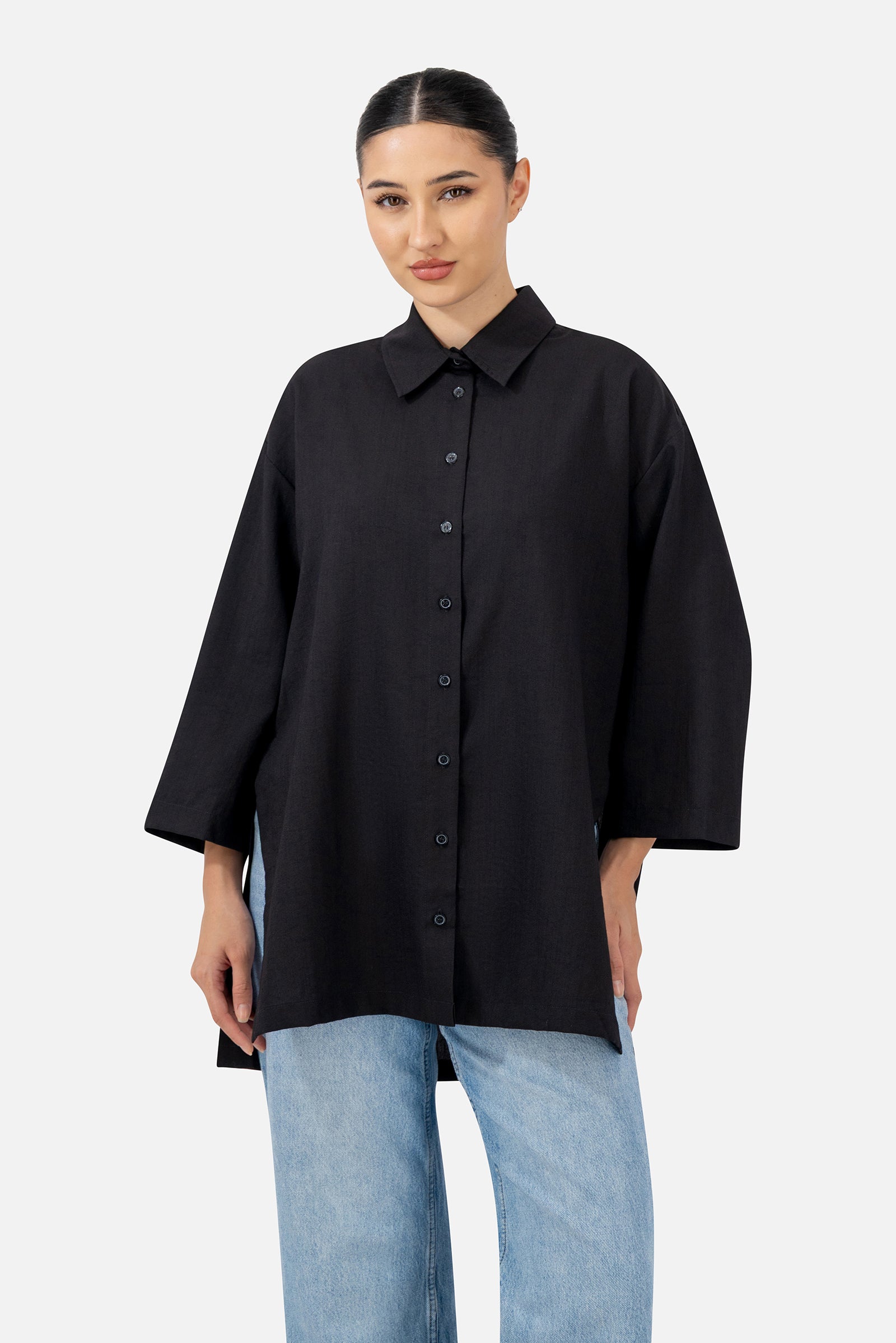 Front view of the Black Wide Sleeve Tunic featuring a button-up design and relaxed long-sleeve silhouette.