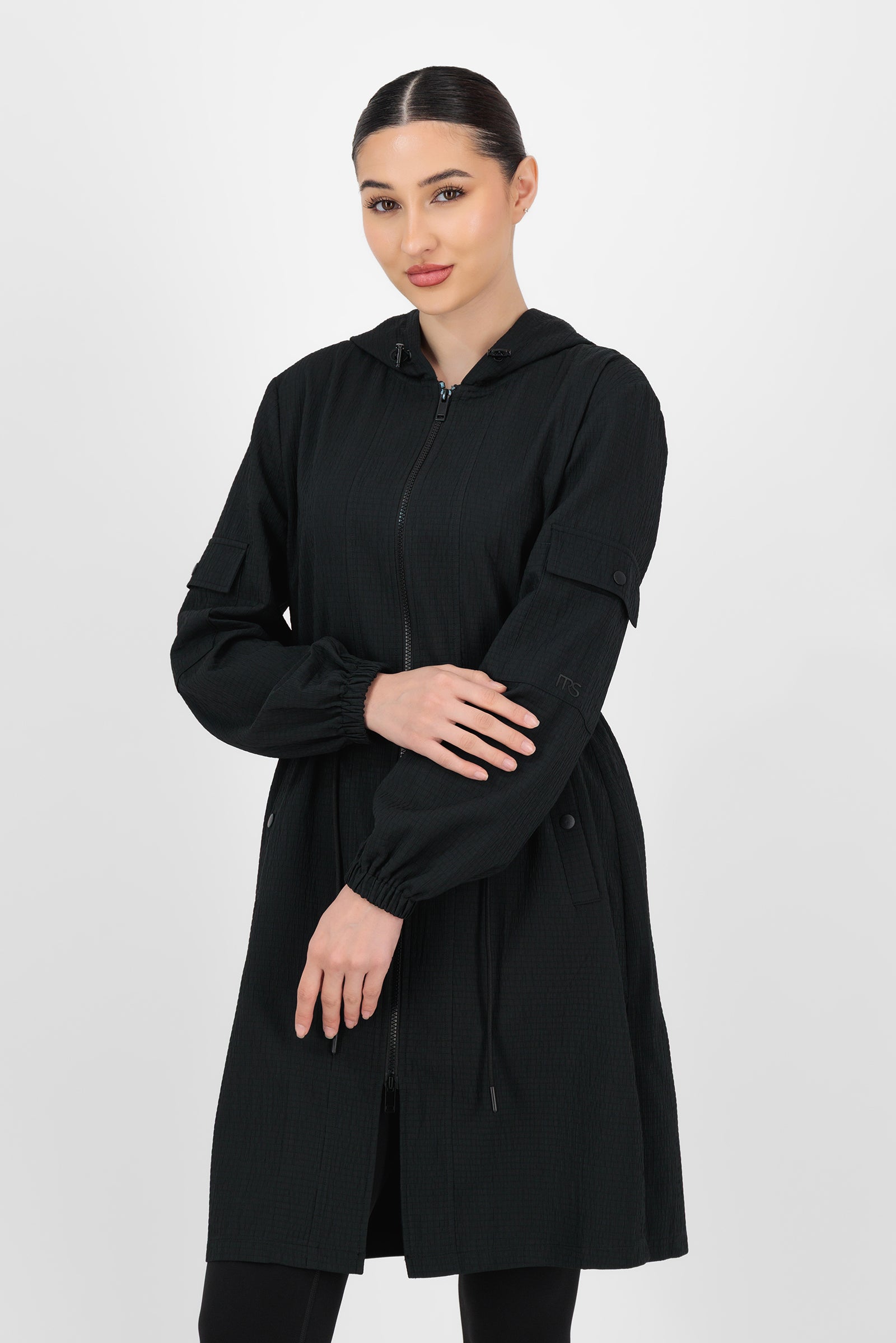 Alternate front pose of the Black CityLite Track Jacket showing the lightweight feel and easy, sporty silhouette that define a versatile track jacket.