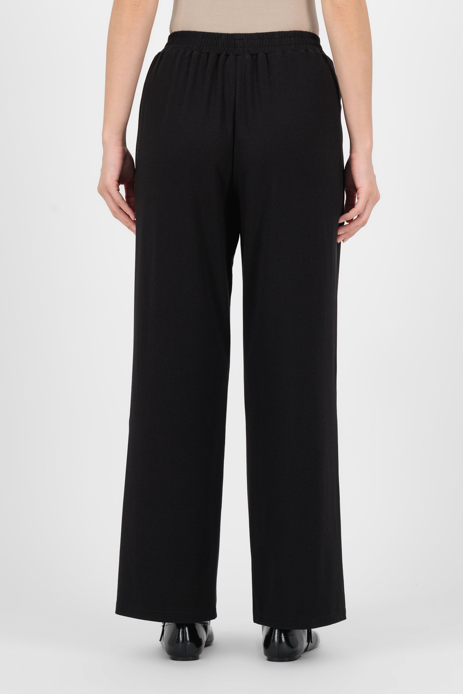 Back view of the Black Elastic Waist Straight Leg Trouser highlighting the smooth waistband and streamlined cut that make these trouser pants for women comfortable and refined.