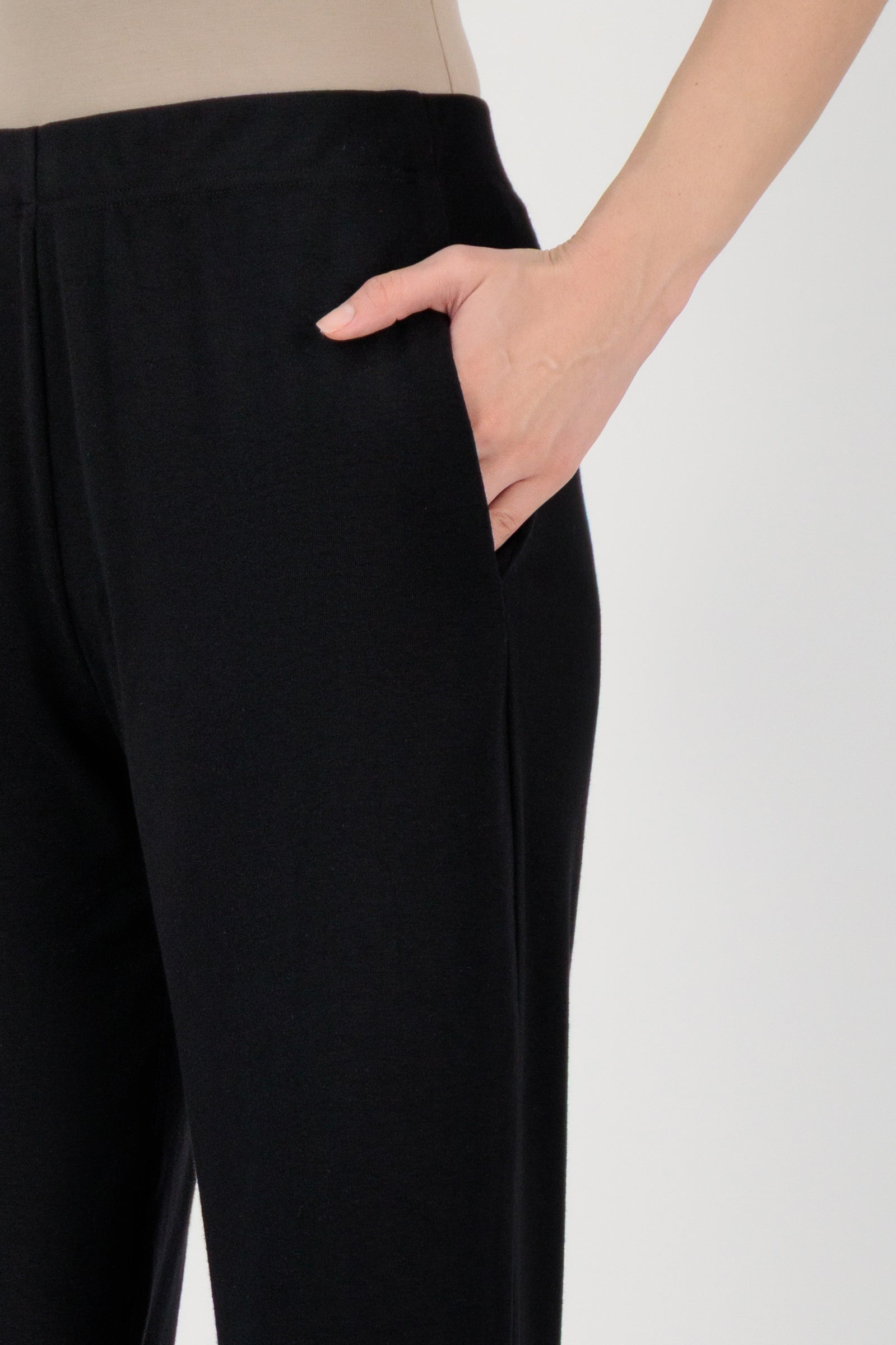 Close-up detail of the FARES Straight Leg Knit Pants in Black focusing on the knit texture and pocket finish of these knit pants.