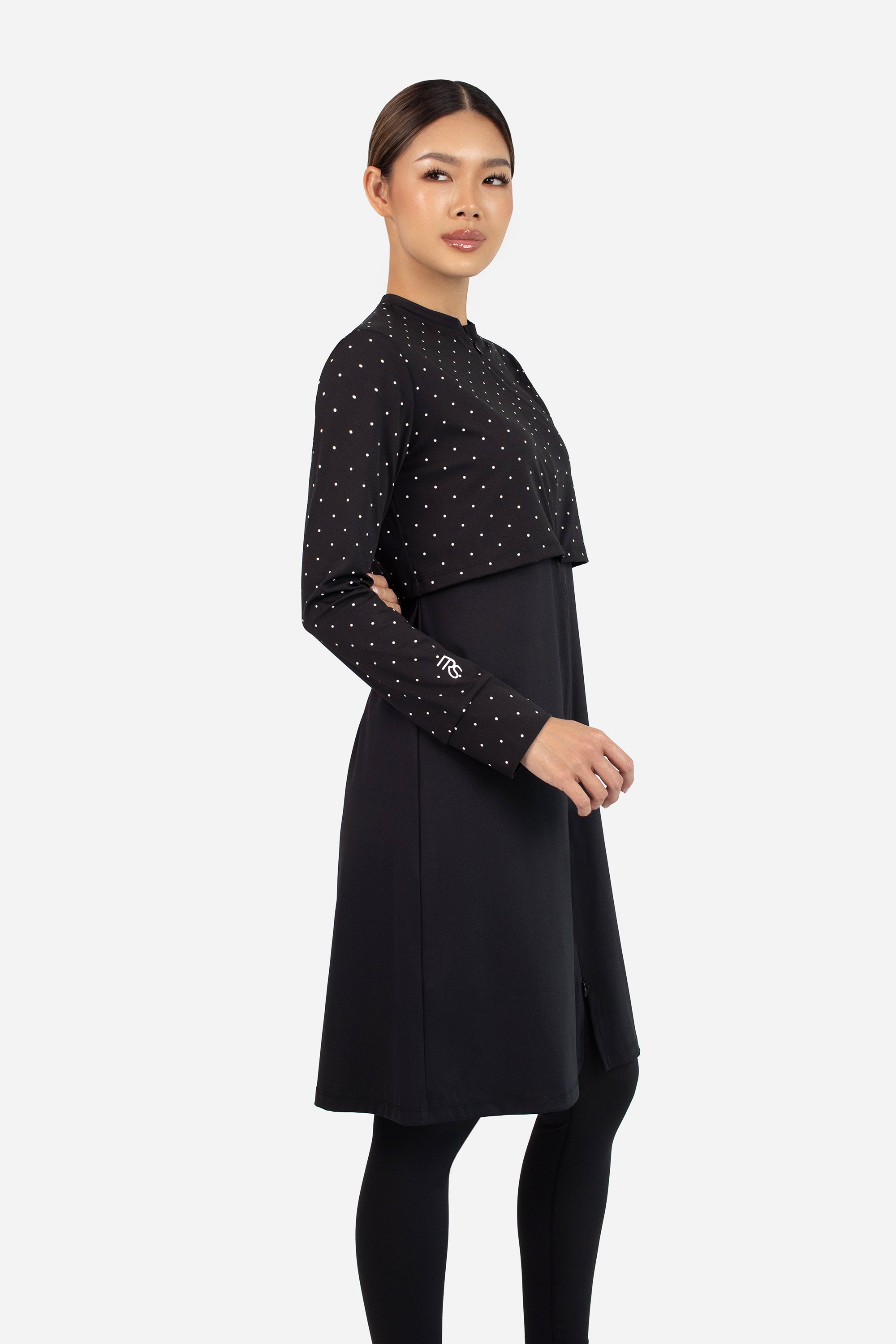 Back view of the FARES Zip-Up Quick-Dry Modest Swim Set in Black Polka, highlighting the longline top and secure fit ideal for swim suits for ladies.