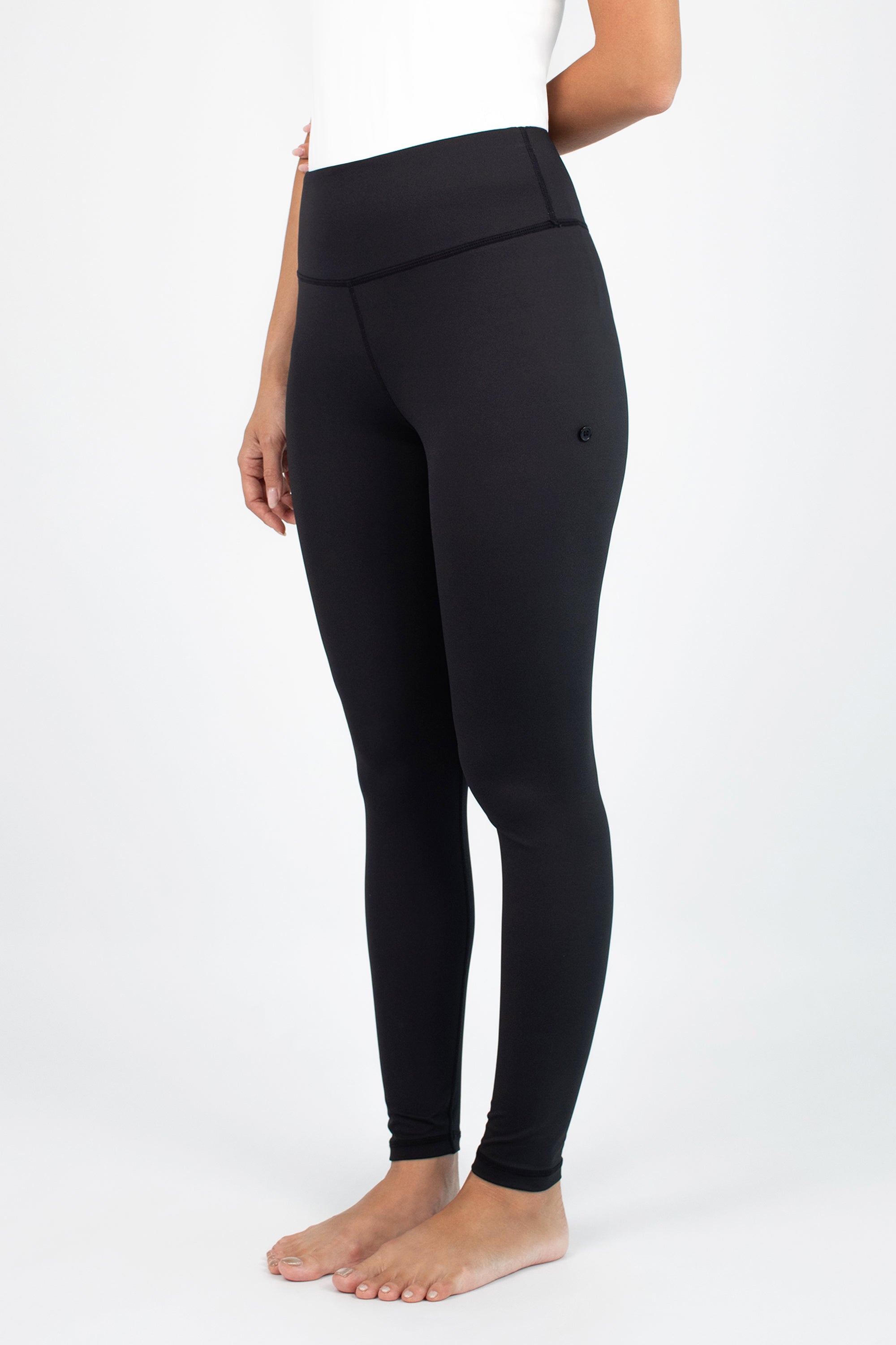 Cropped view of the upper half of the FARES Zip-Up Quick-Dry Modest Swim Set in Black Polka, highlighting the polka print and fitted sleeves.