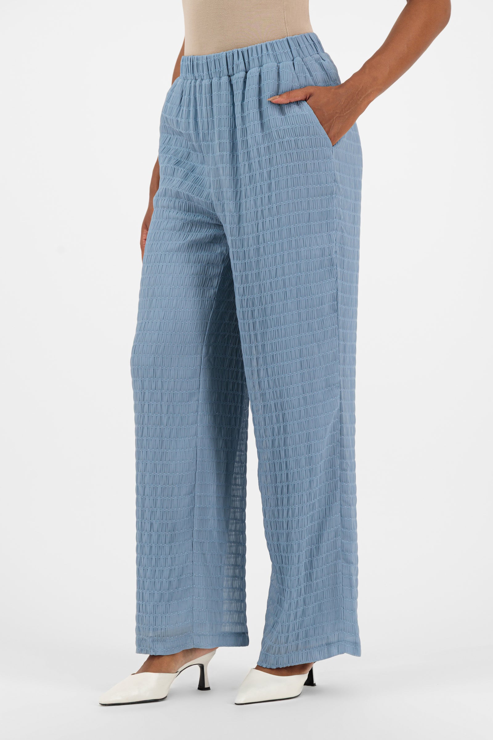 Close-up of the pleats and hem on the FARES Shirred Wide Leg Pants in Berry, emphasizing the comfort and structure of relaxed fit wide leg pants.