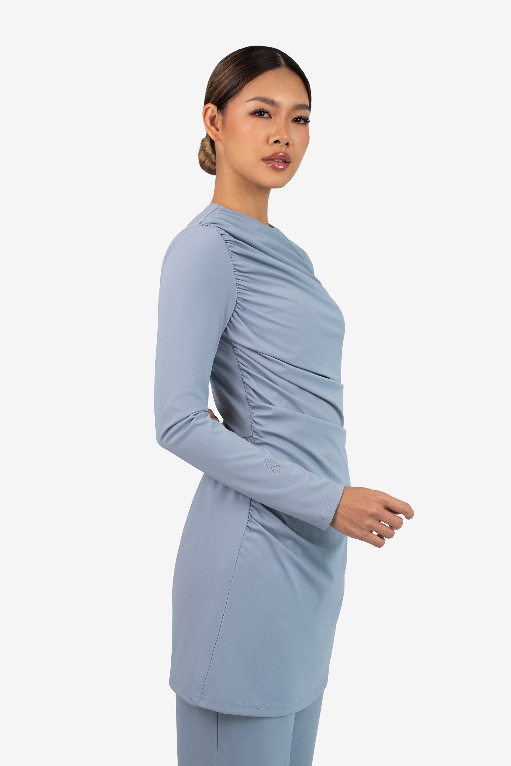 Back view of the FARES Gathered Quick-Dry Modest Swim Set in Coastal Blue, highlighting the long hem and clean silhouette ideal for swim suits for ladies.