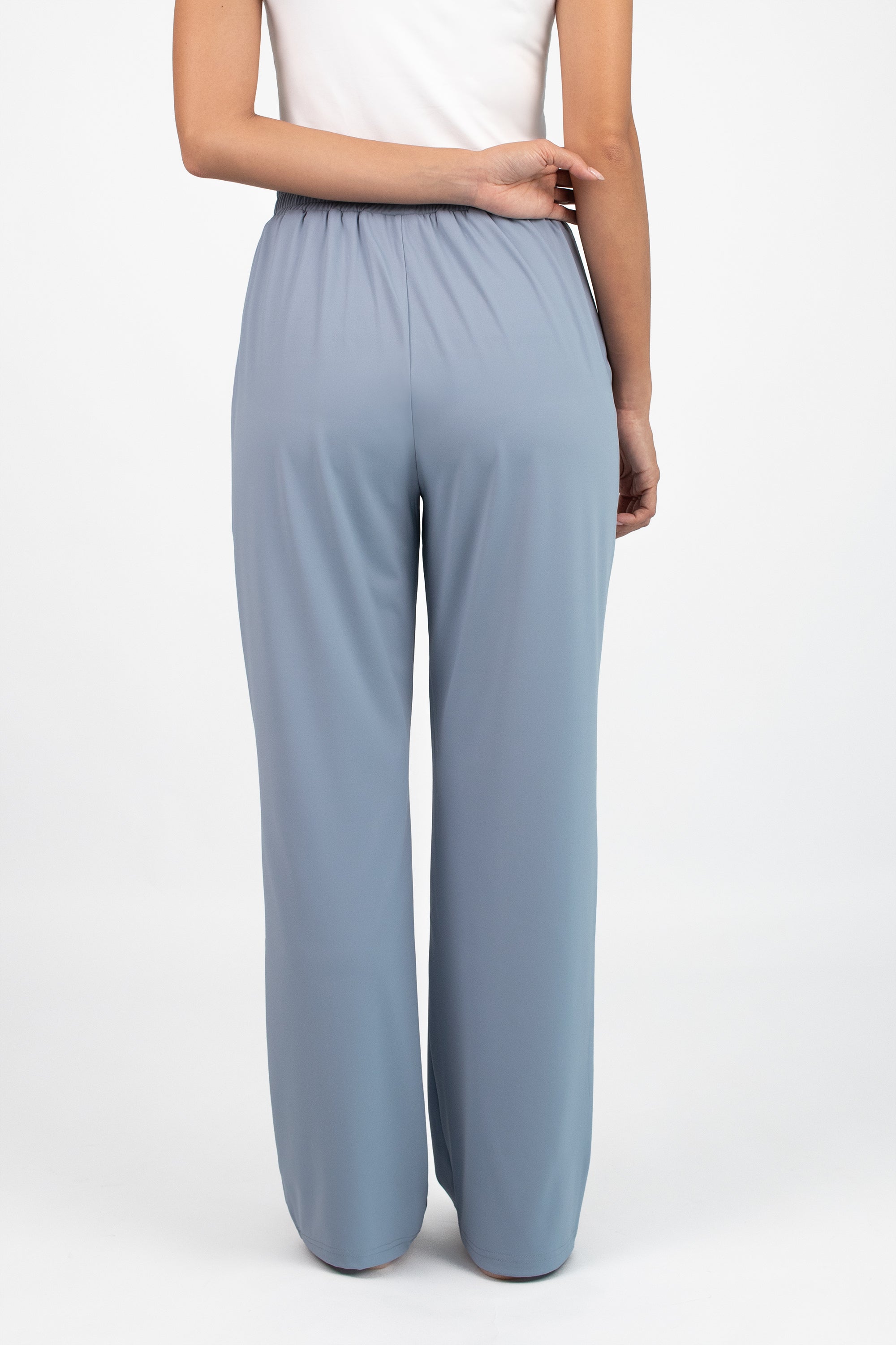 Model standing in the FARES Gathered Quick-Dry Modest Swim Set in Coastal Blue, showing the lightweight fabric and flattering shape of the swim suit.