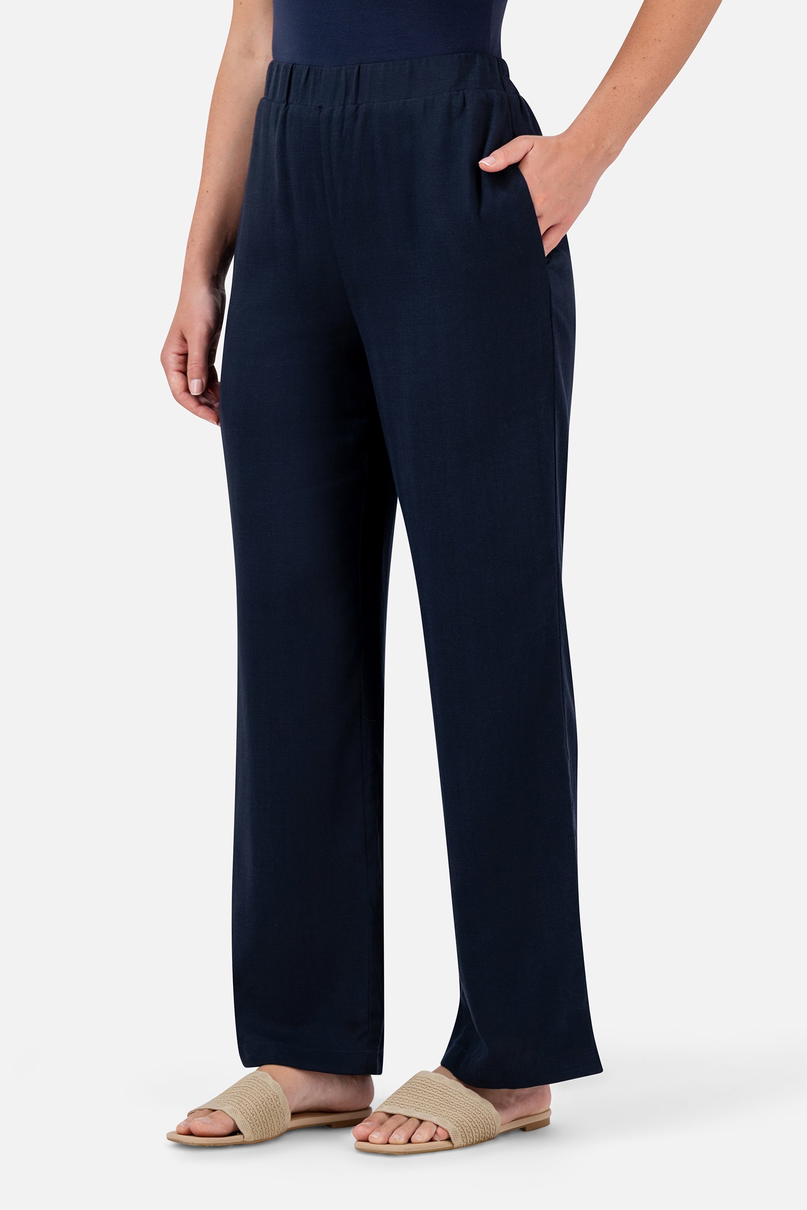 FARES Relaxed Fit Pants in Navy shown from the side, featuring a relaxed shape and full-length design for comfortable everyday wear.