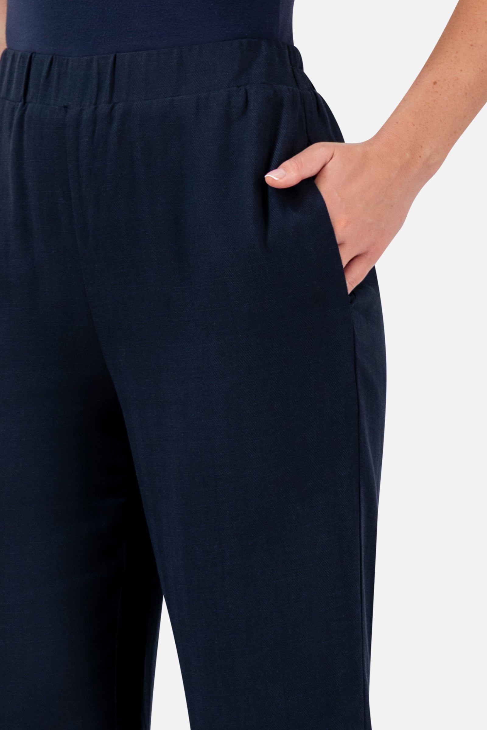 Closer view of the FARES Relaxed Fit Pants in Navy, highlighting the elasticated waistband, side pocket and softly draped fabric.
