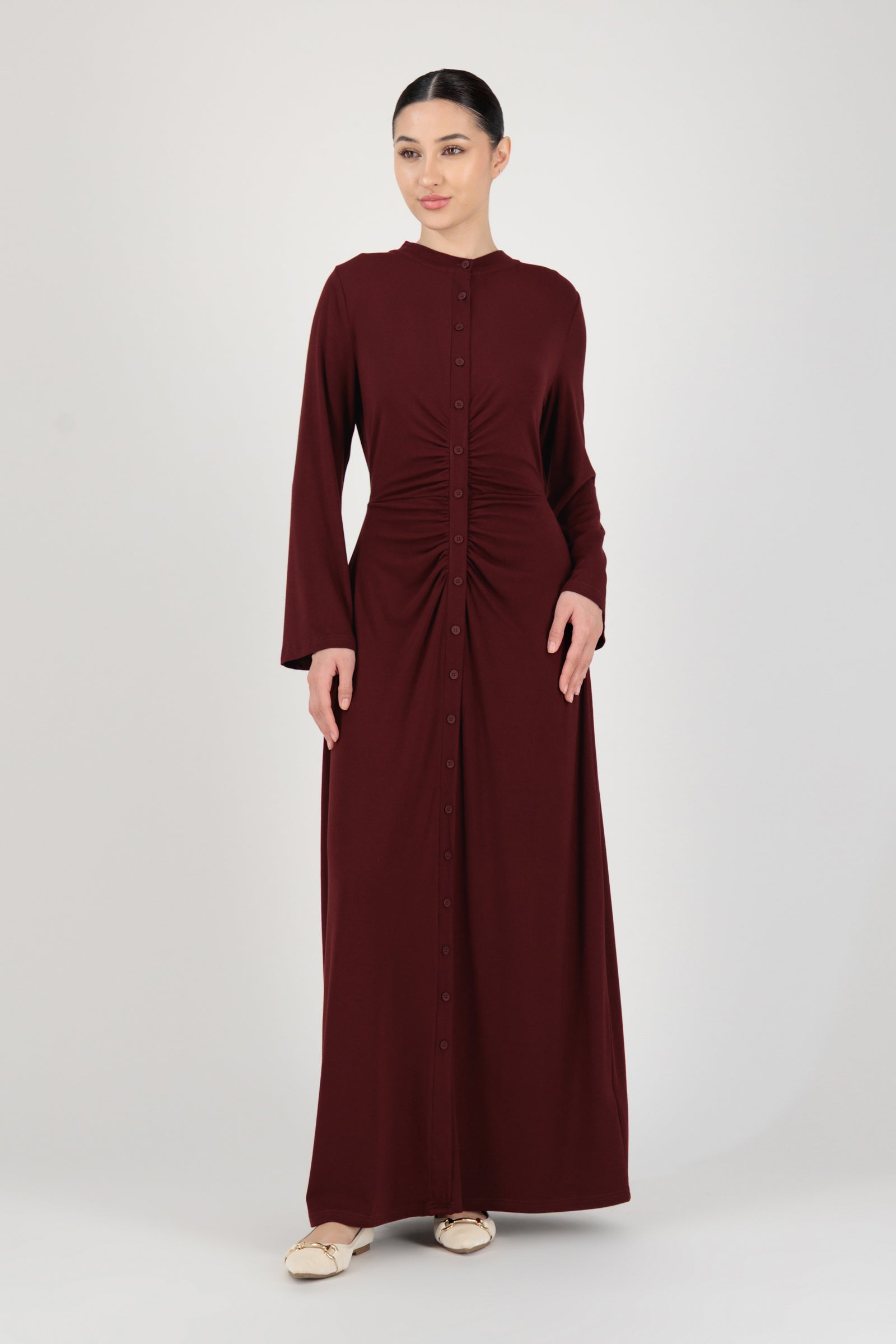FARES Gathered Waist Knit Dress in Black Cherry shown from the front as an elegant knit dress with a flowing long sleeve dress silhouette.