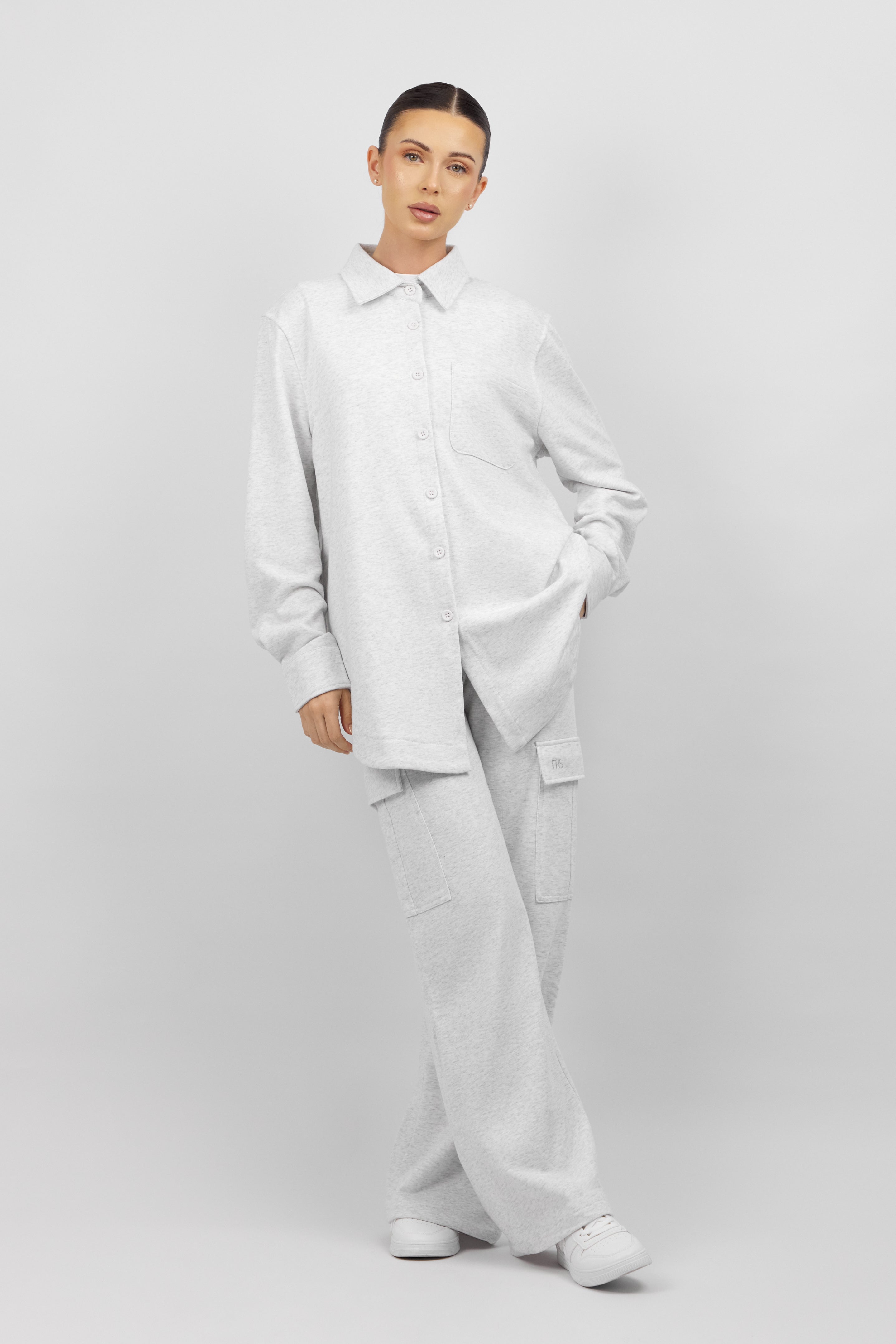 Colour: Cloud. A model in a front pose wearing an Oversized Cotton Shacket.