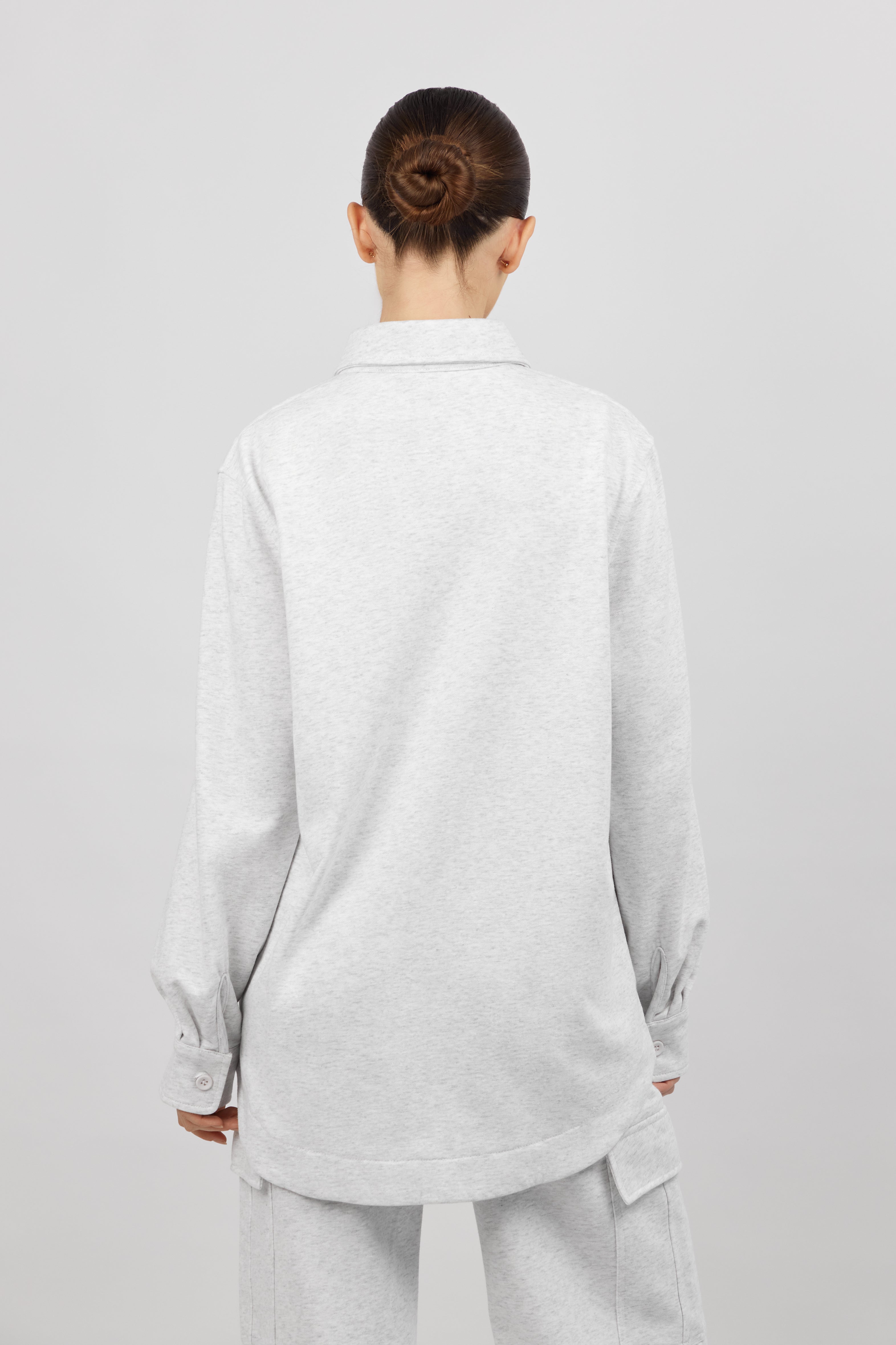 Colour: Cloud. The back of a model wearing an Oversized Cotton Shacket.