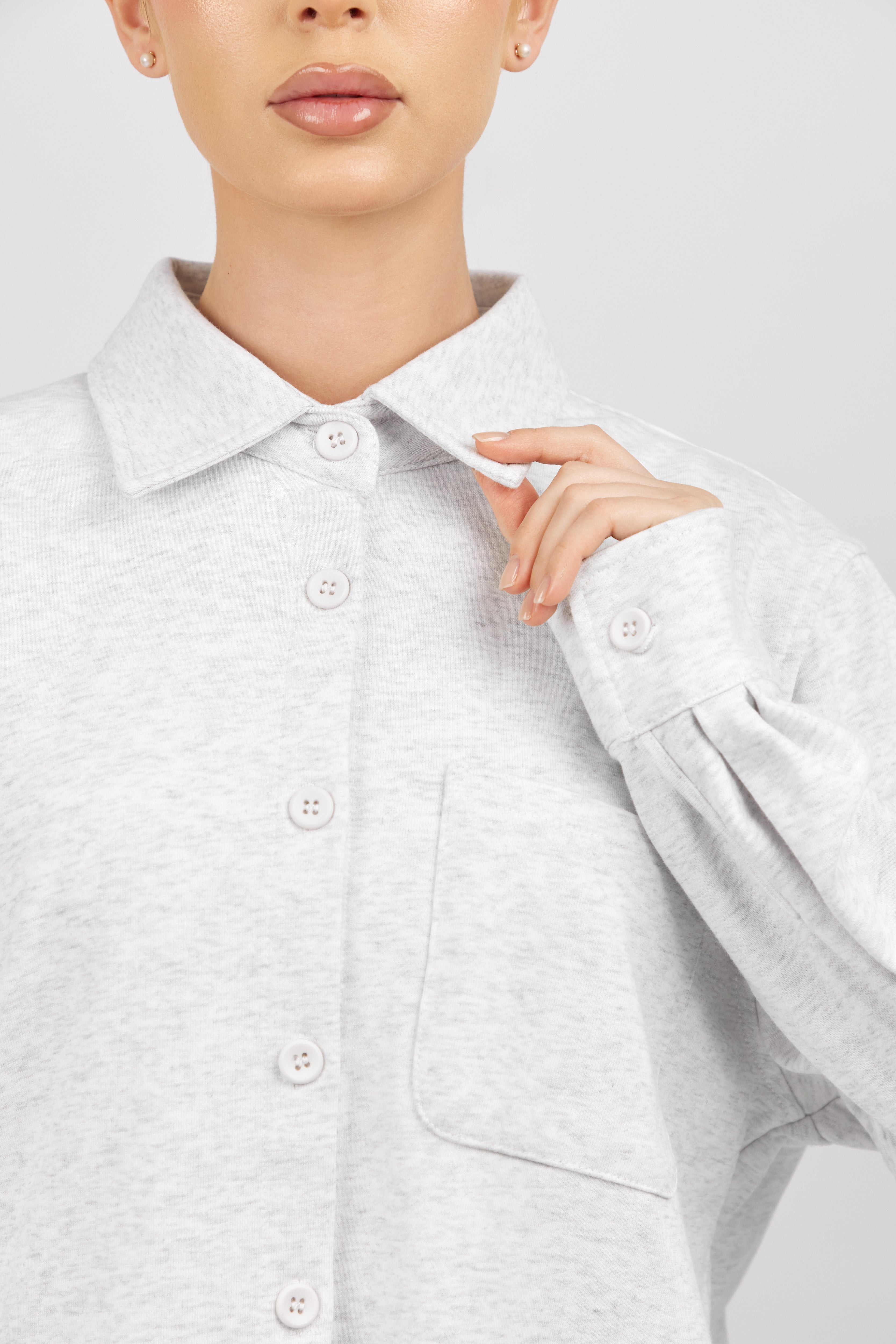 Colour: Cloud. A close up of a woman wearing an Oversized Cotton Shacket.