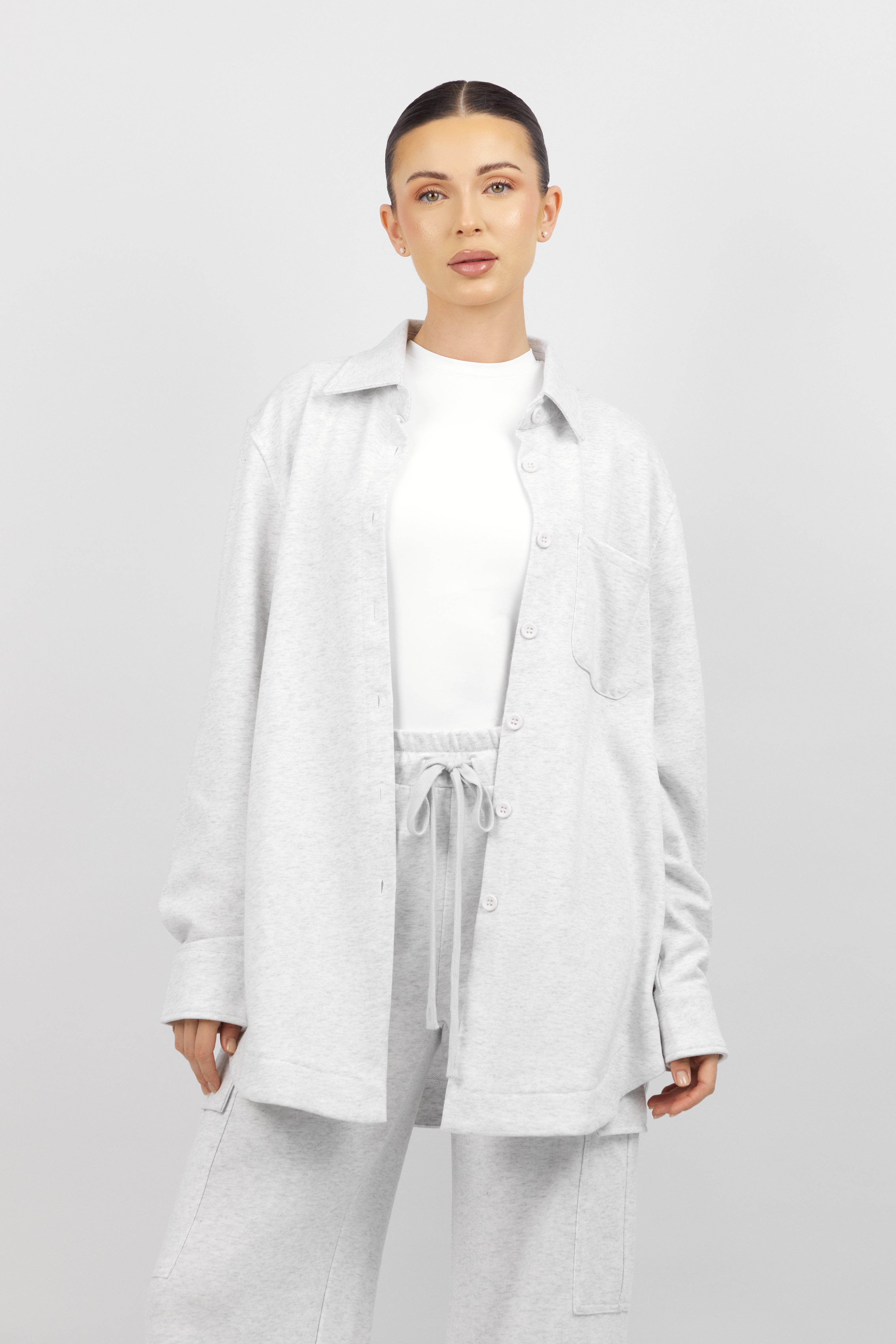 Colour: Cloud. The front of a woman wearing an Oversized Cotton Shacket.