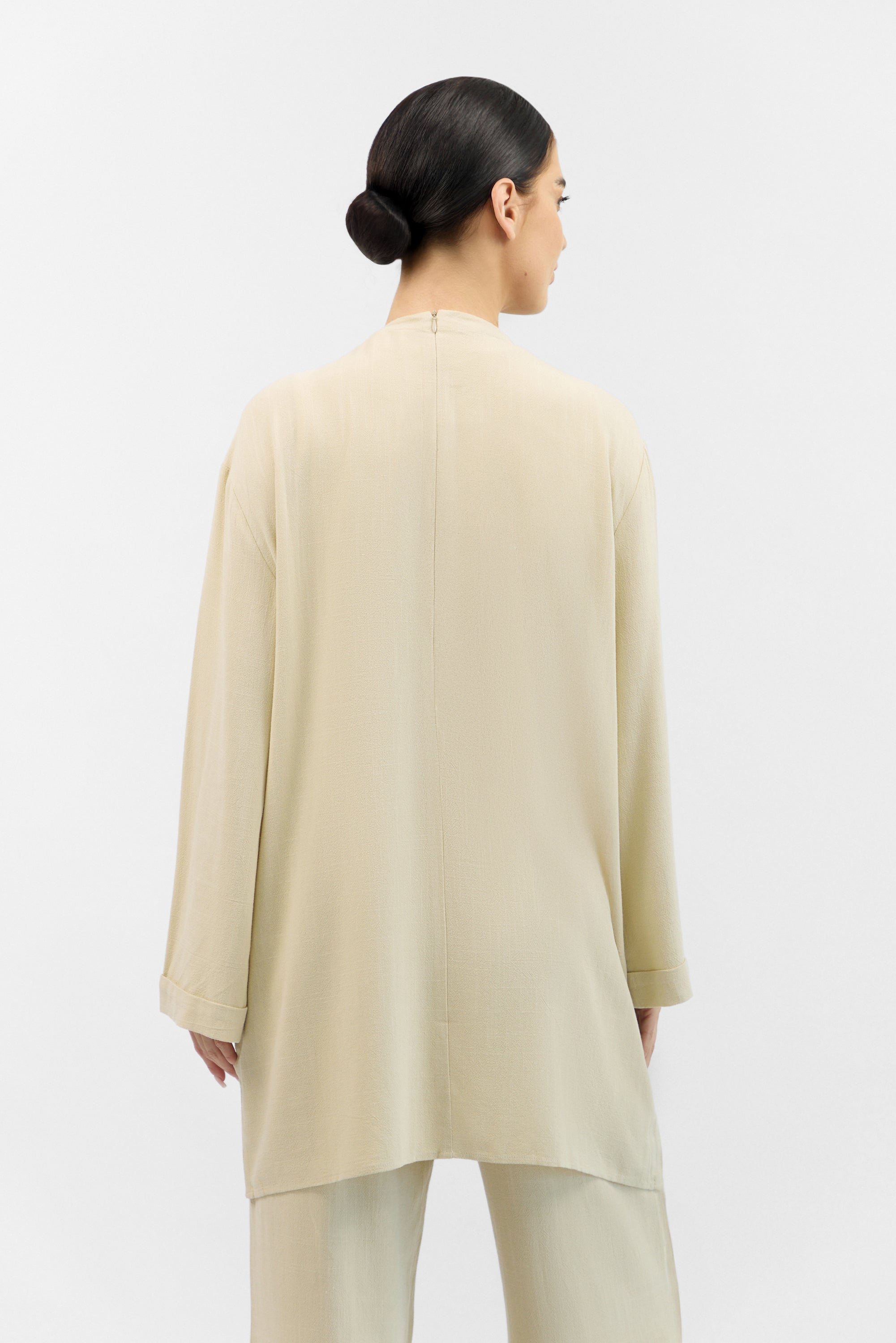 Back view of the FARES Linen Blend Top in Taupe, featuring a clean silhouette and soft linen blend fabric.