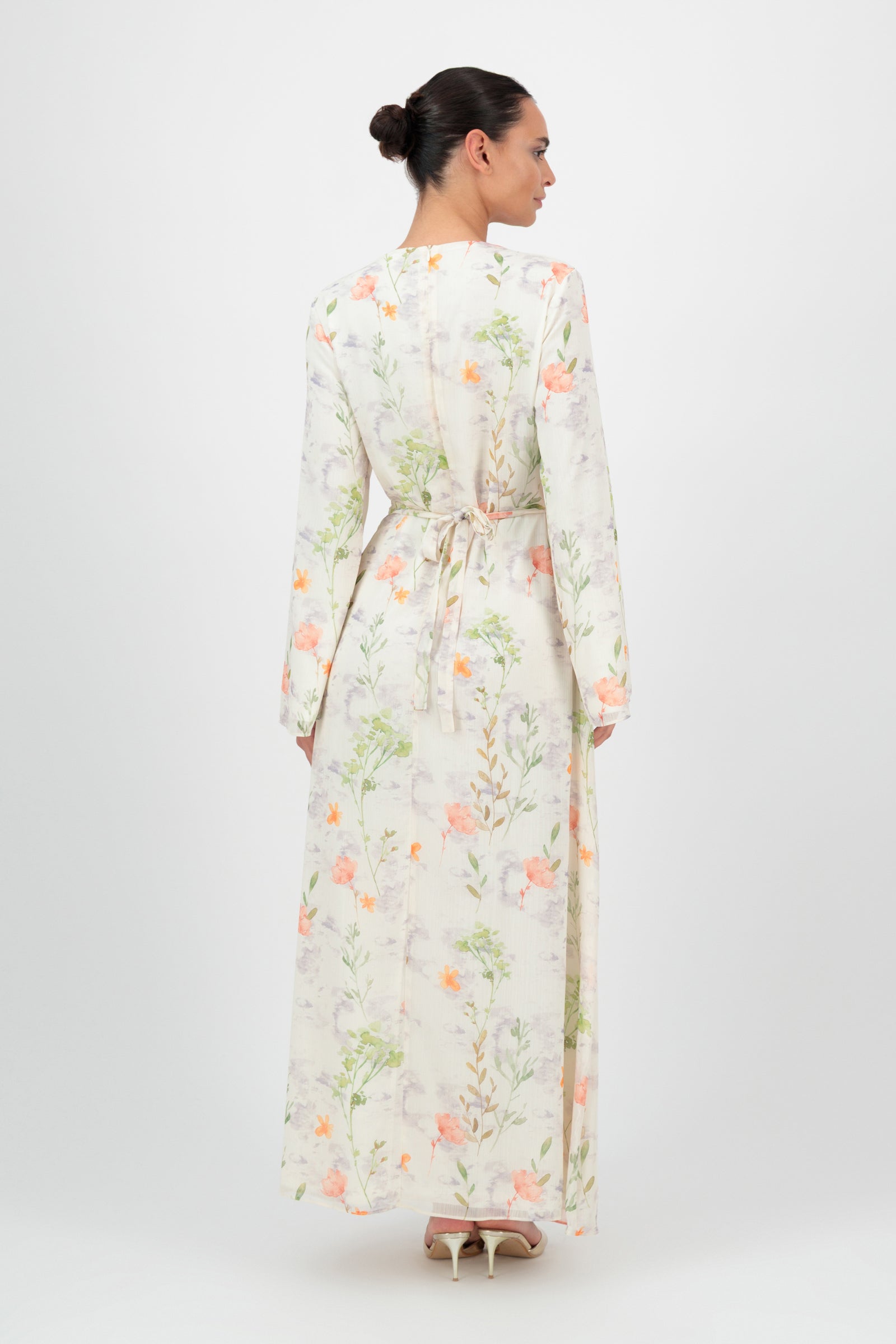 Back view of the FARES Scrunched Waist Chiffon Dress in Wildflower highlights the full-length silhouette of this airy chiffon dress.