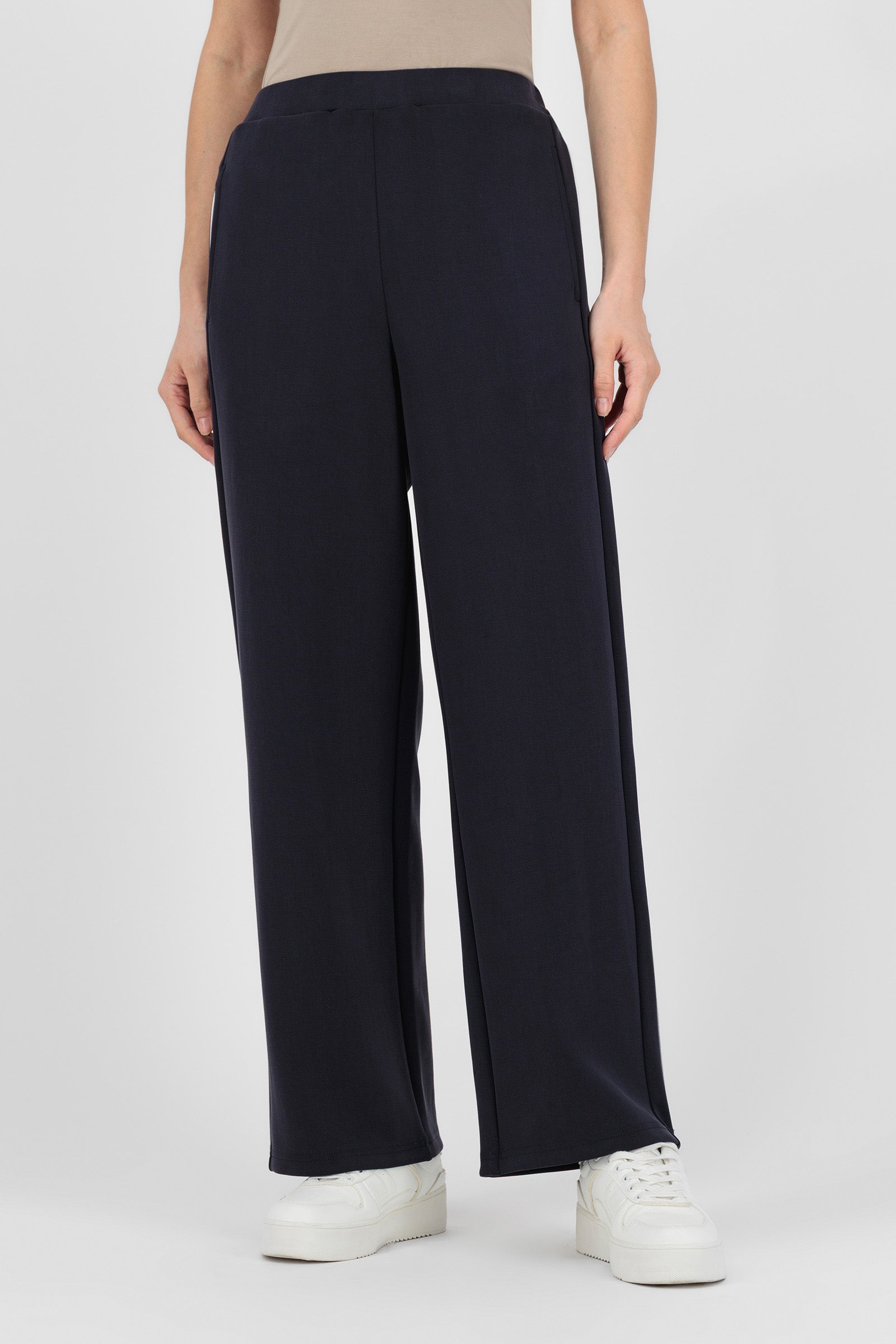 Model wearing the Buttery Straight Leg Jogger in Midnight Blue front view, showing the smooth fit and relaxed straight shape that blends comfort with the clean look of straight leg pants.