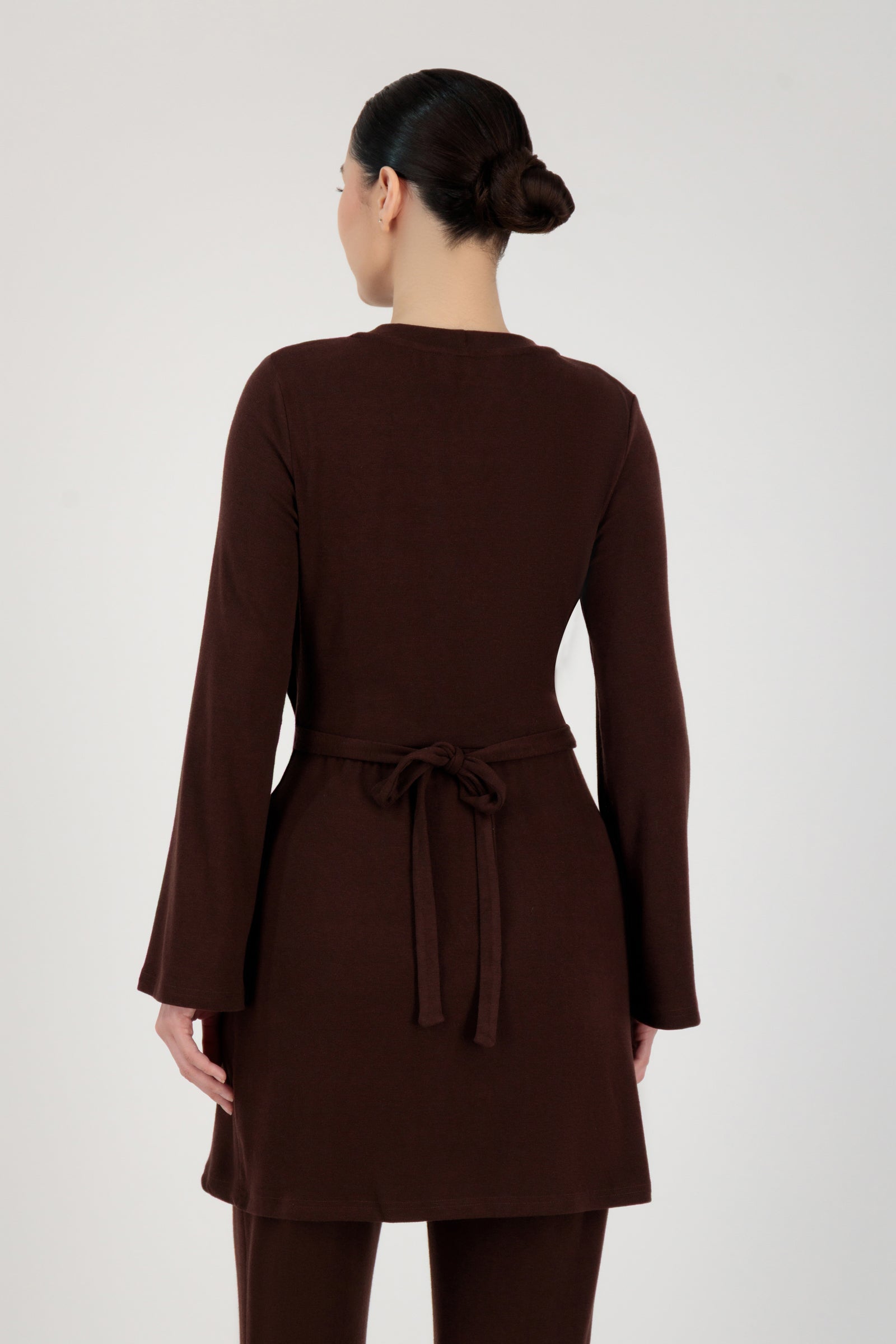 Back view of the FARES Button Detail Knit Tunic in Brownie highlighting clean tunic lines and a balanced, relaxed fit.