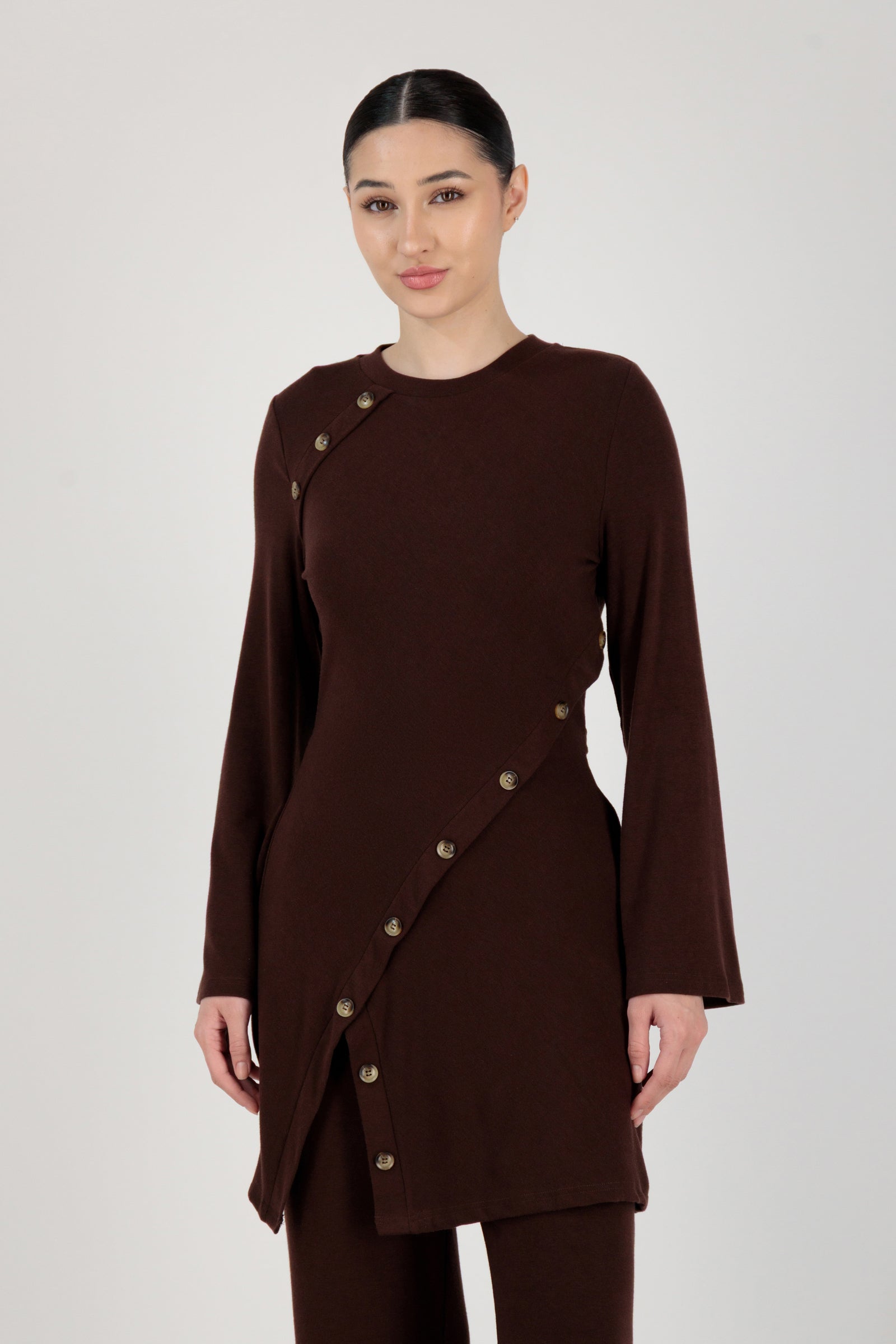 Front view of the FARES Button Detail Knit Tunic in Brownie styled naturally, showing how this button-up tunic falls effortlessly on the body.