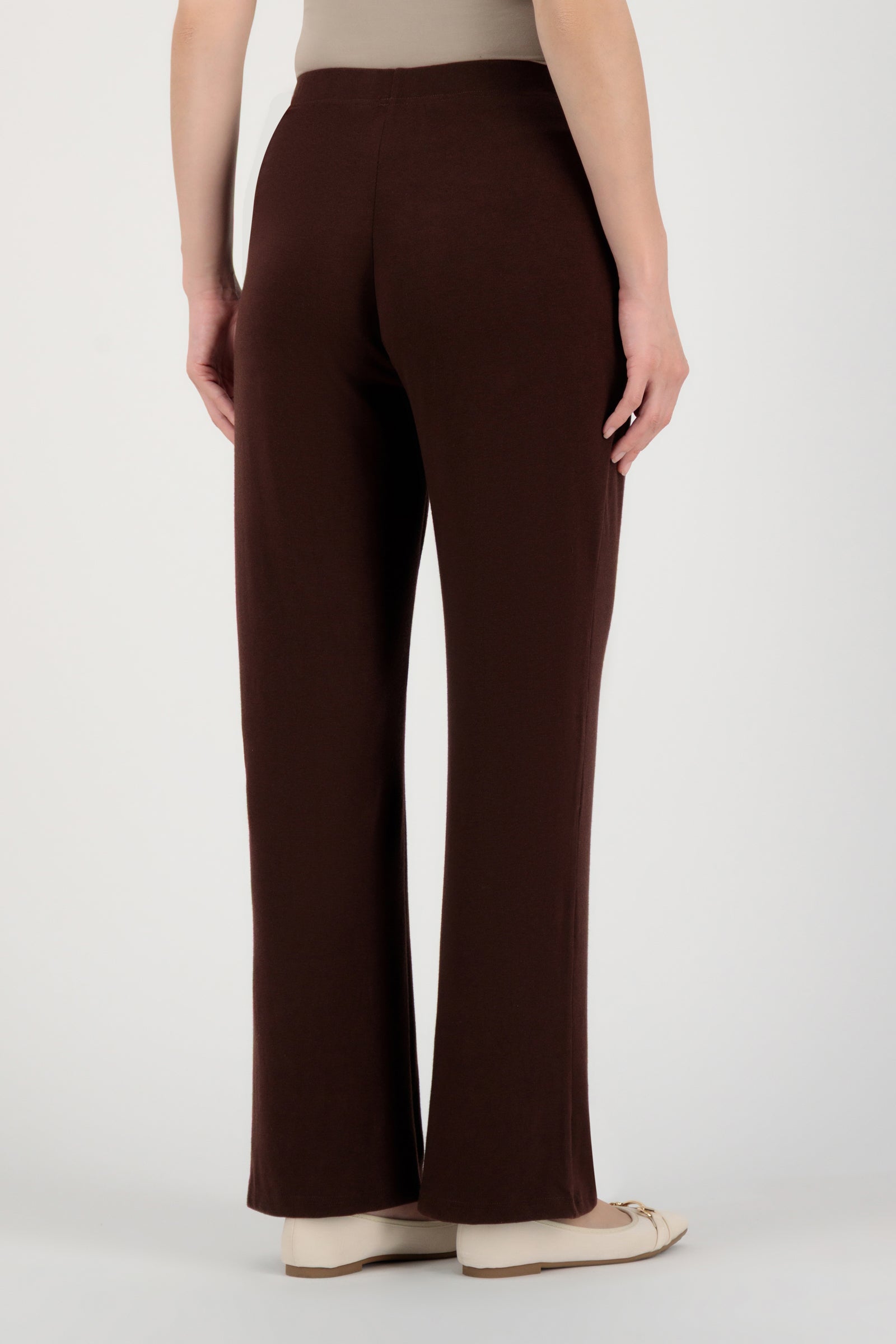Back view of the FARES Straight Leg Knit Pants in Brownie highlighting the relaxed structure and smooth fall of these knit pants.
