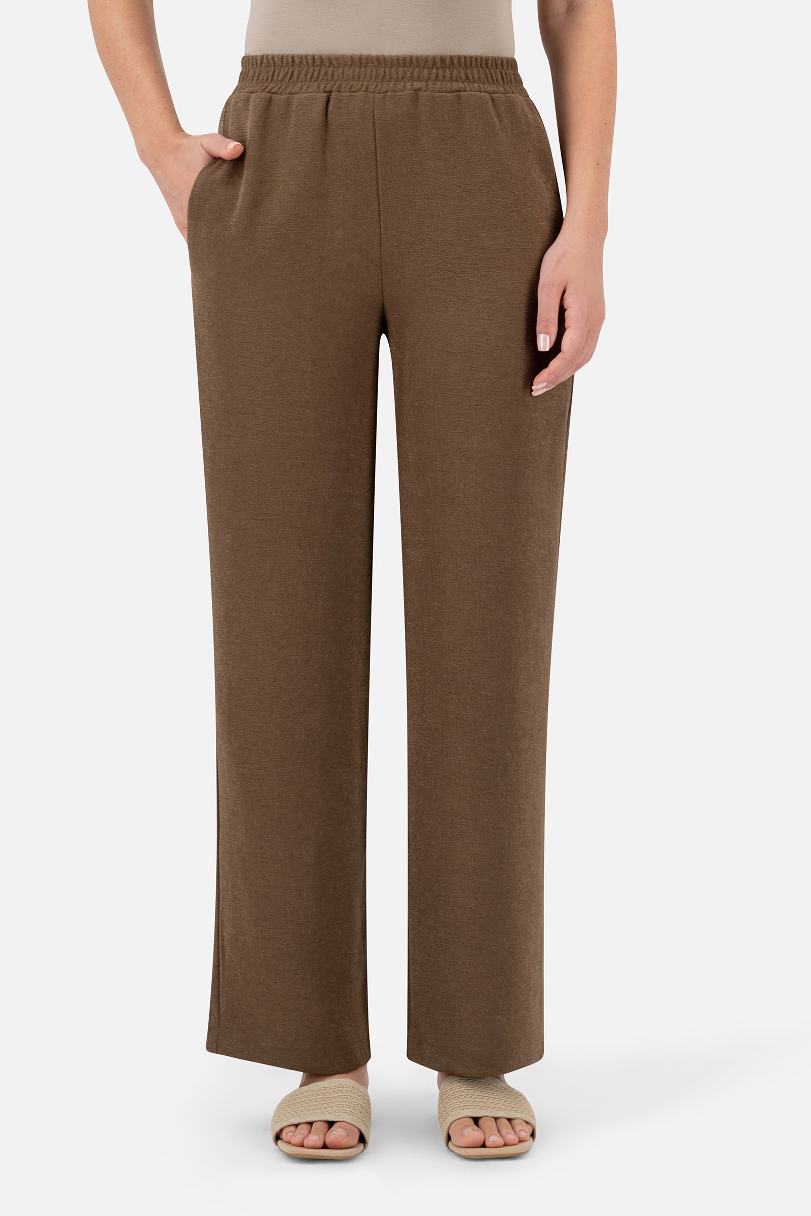Woman wearing the Espresso relaxed fit pants, front view.