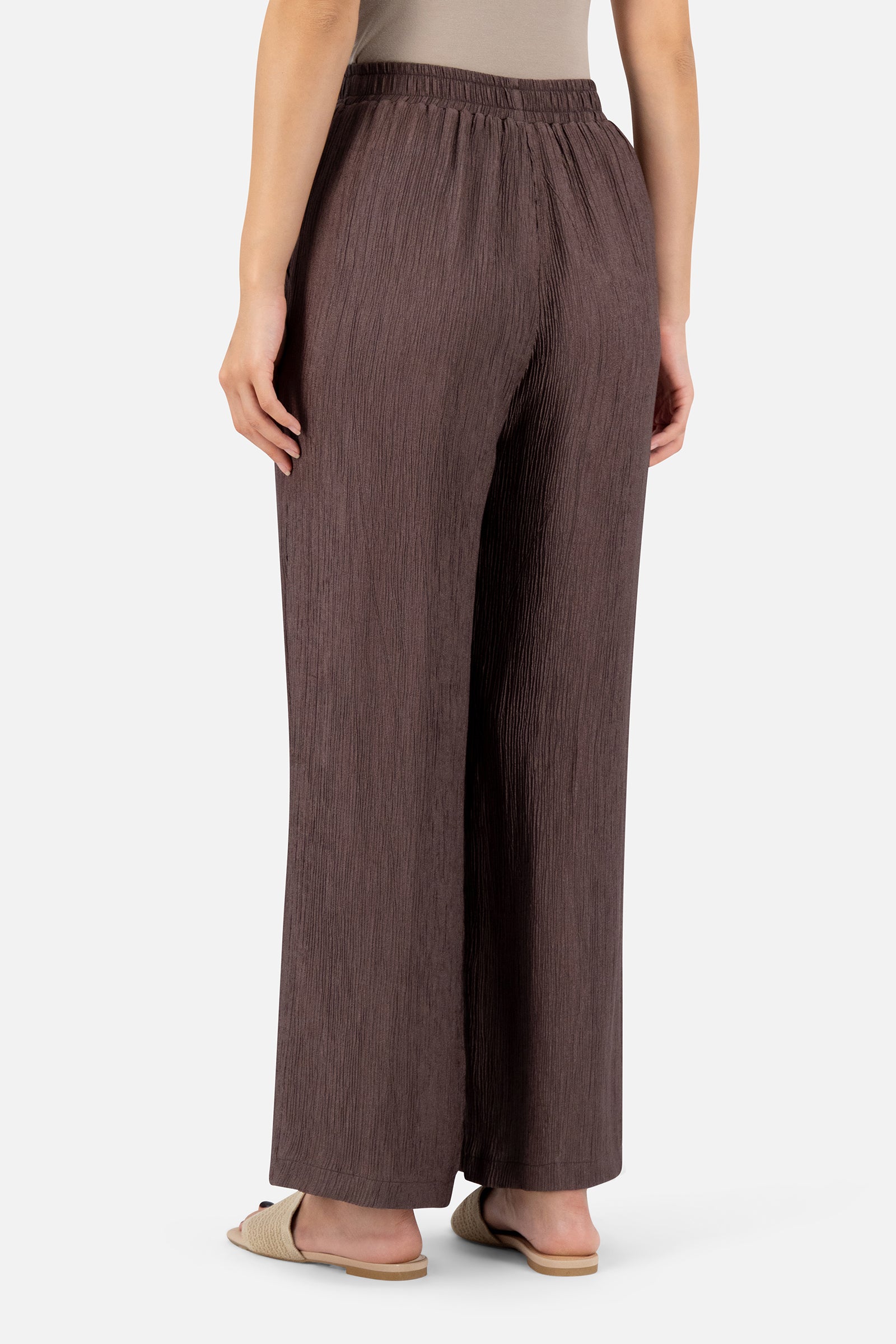 Back view of the Icy Brown relaxed fit pants showcasing the textured rippled fabric and relaxed fit.