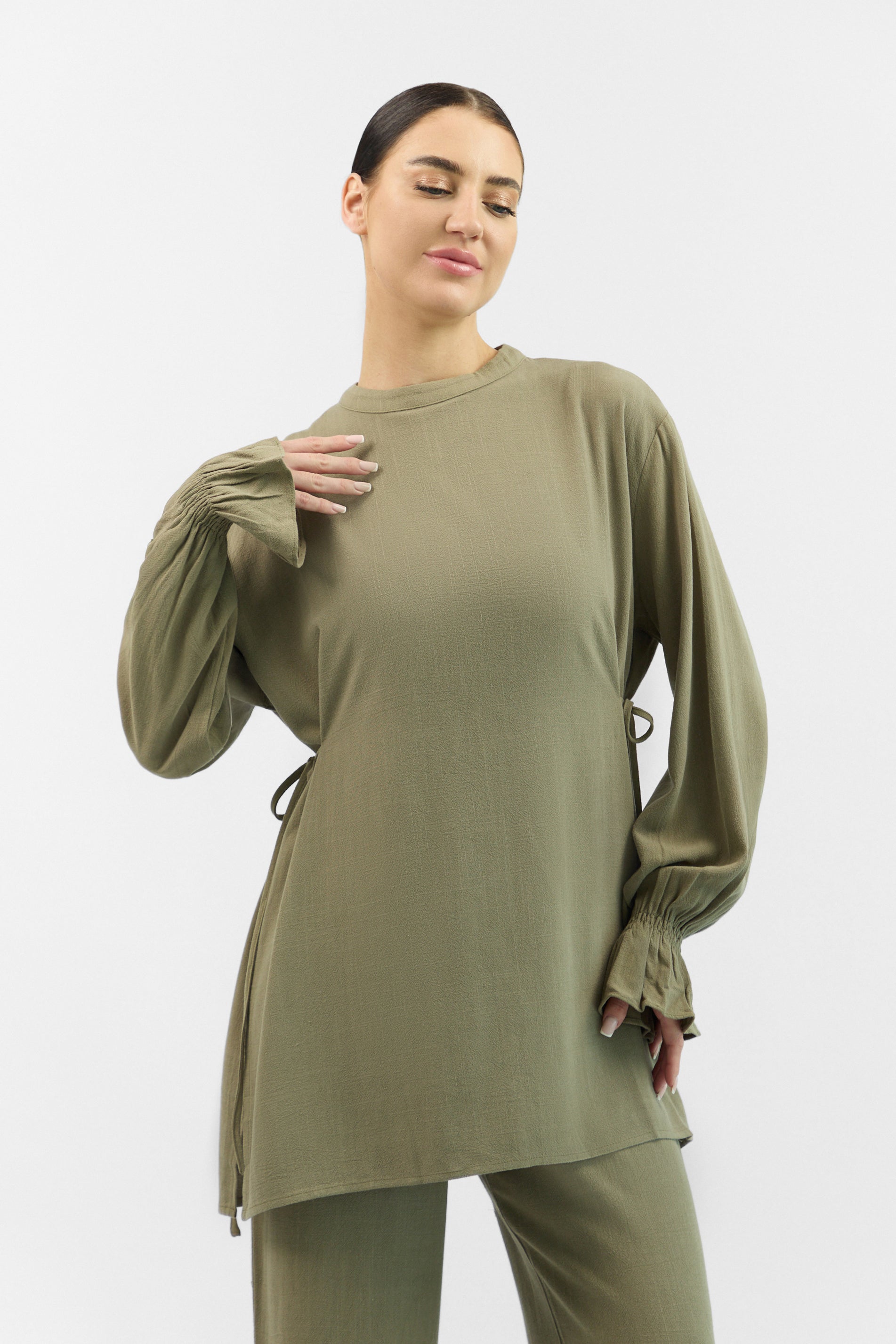 Front view of the FARES Bow Detail Linen Blend Top in Olive Green, a lightweight and breathable linen top with a delicate bow detail.