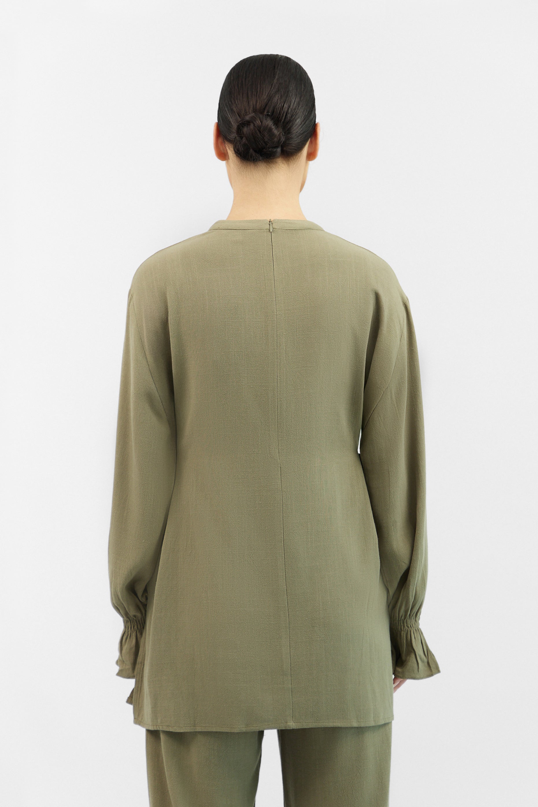 Back view of the FARES Bow Detail Linen Blend Top in Olive Green, featuring a simple silhouette and soft bow accent.