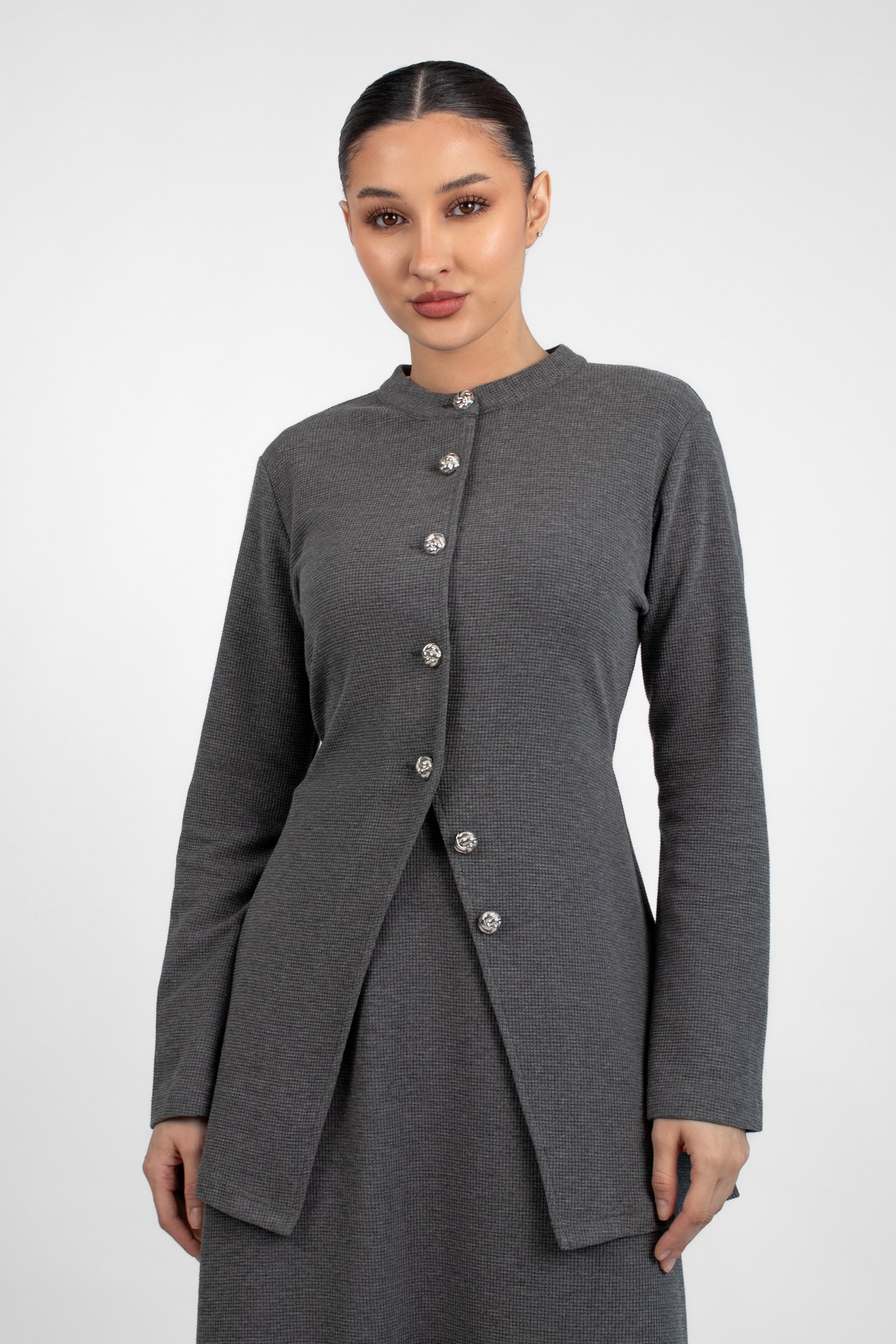 A close up of a model in a front pose in a Tailored Vintage Cardigan.