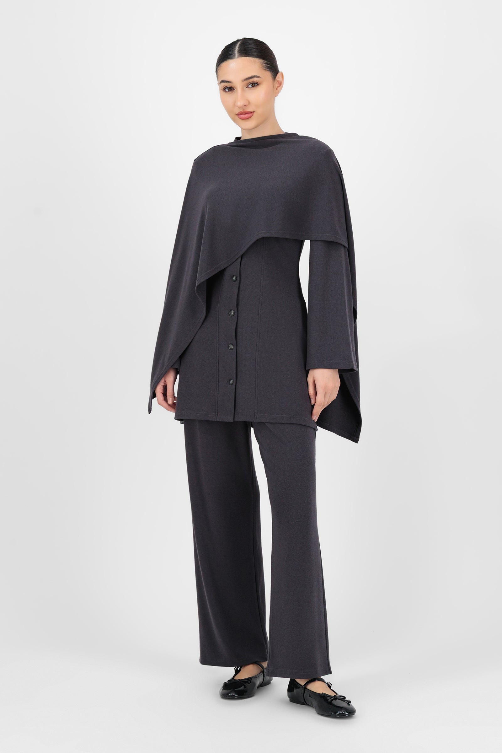 Full-body shot of the model wearing the Charcoal Straight Leg Knit Pants styled with a simple top, showing how versatile and easy these knit pants are for everyday outfits.