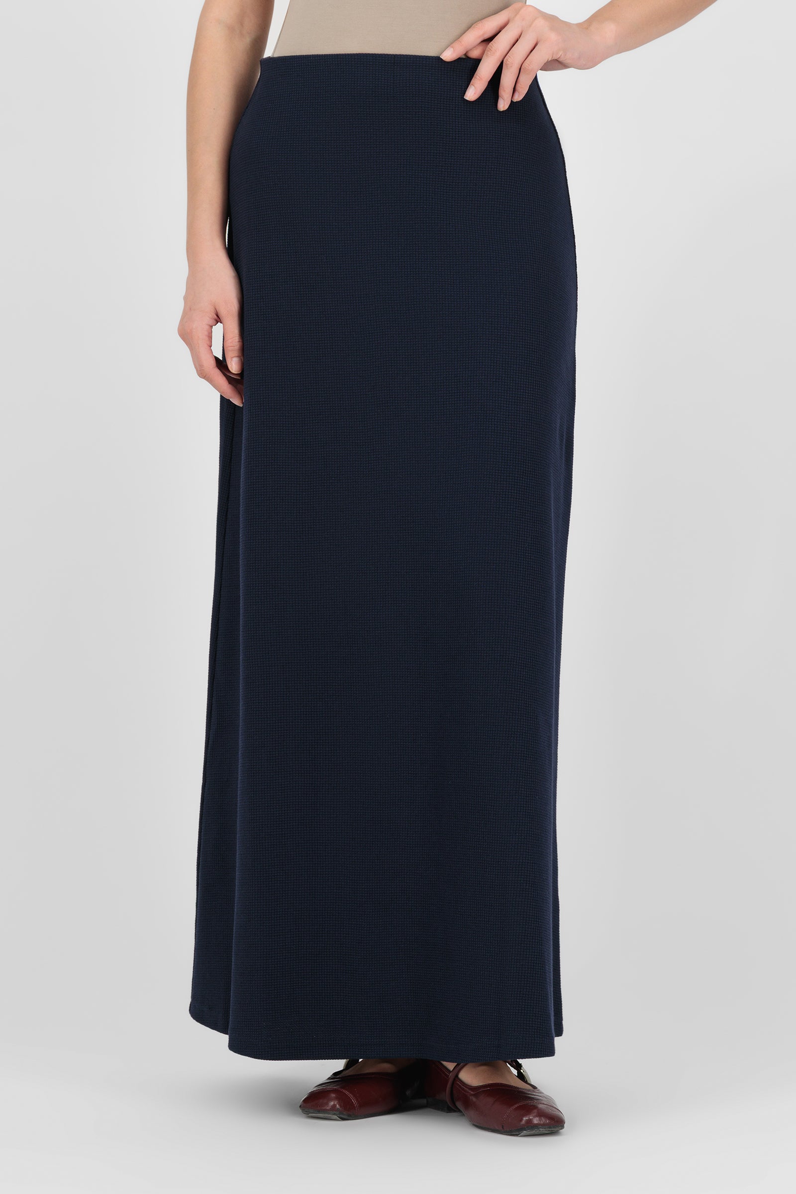 Alternate front pose of the Navy Tailored Maxi Skirt showing the structured fit and minimal detailing that give this skirt a graceful, versatile look.