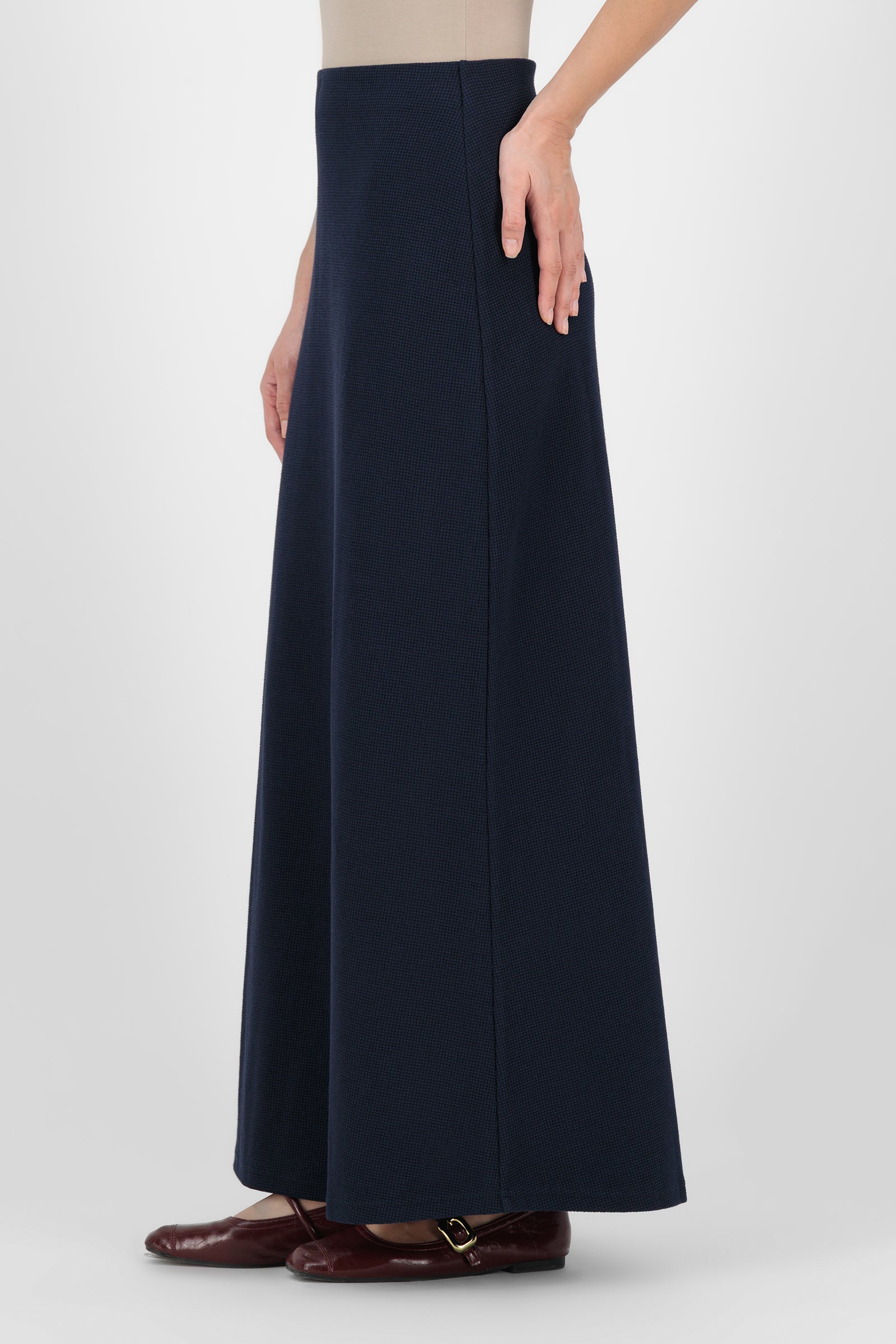 Side angle of the Tailored Maxi Skirt Navy capturing the soft drape and streamlined shape that elevate classic maxi skirts for women.