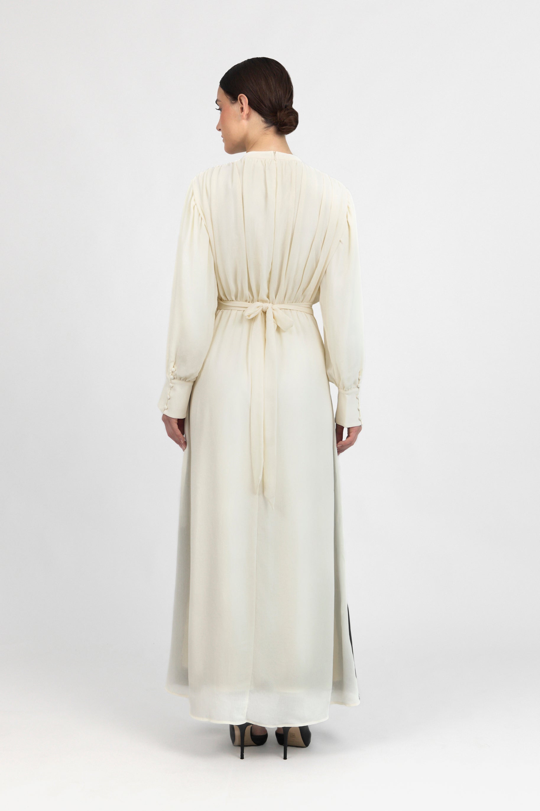 A back pose from a model in a Contrast Pleated Statement Dress