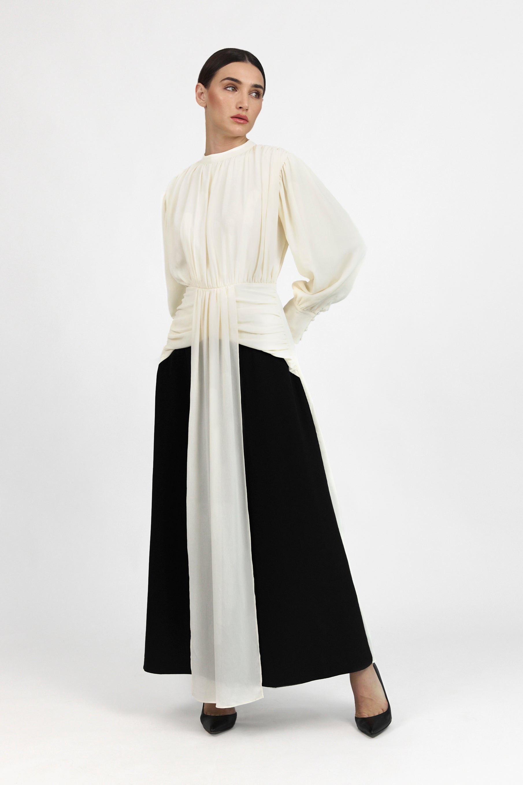 A front pose from a model in a Contrast Pleated Statement Dress