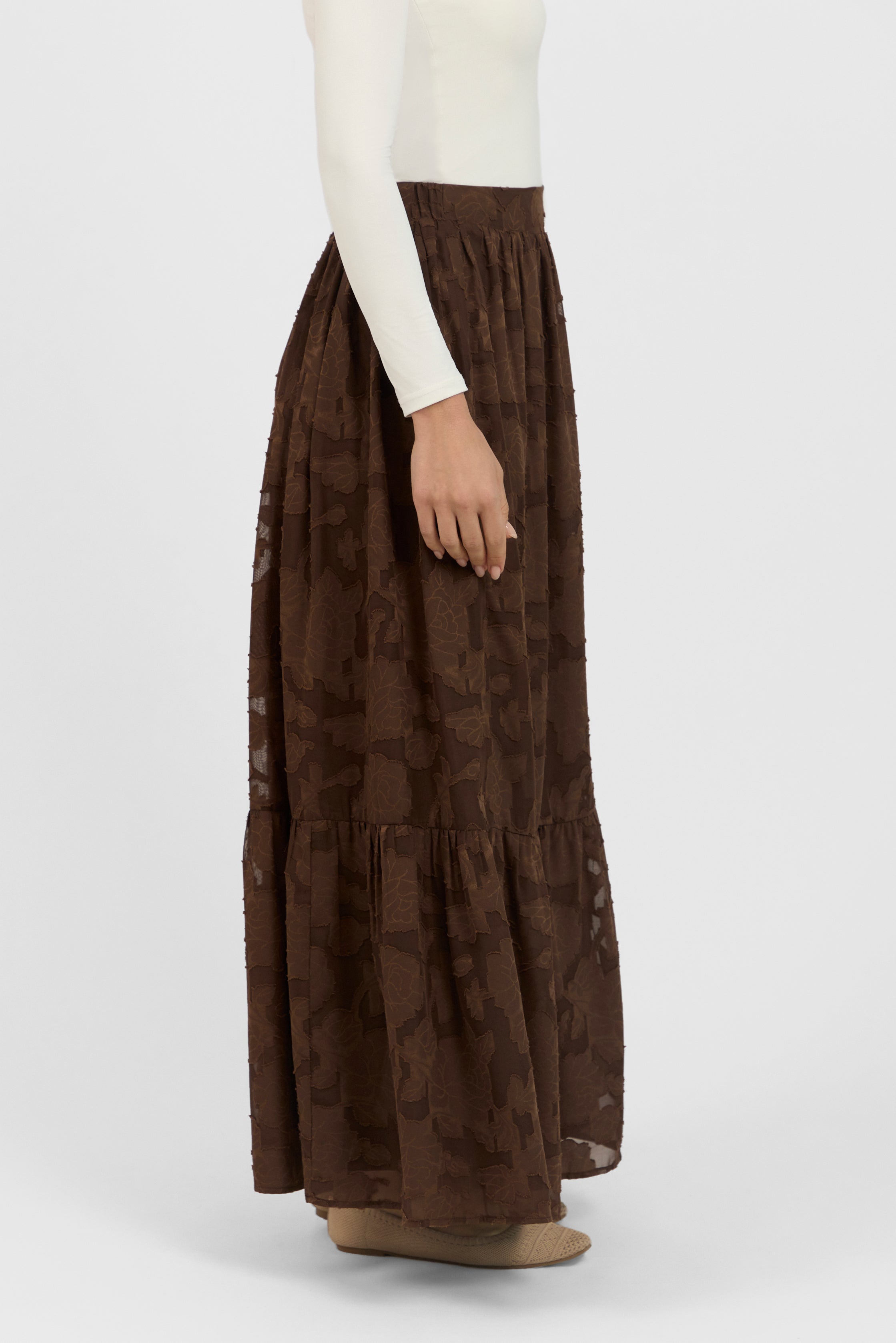 A side view of the skirt from the set.	Colour: Chocolate