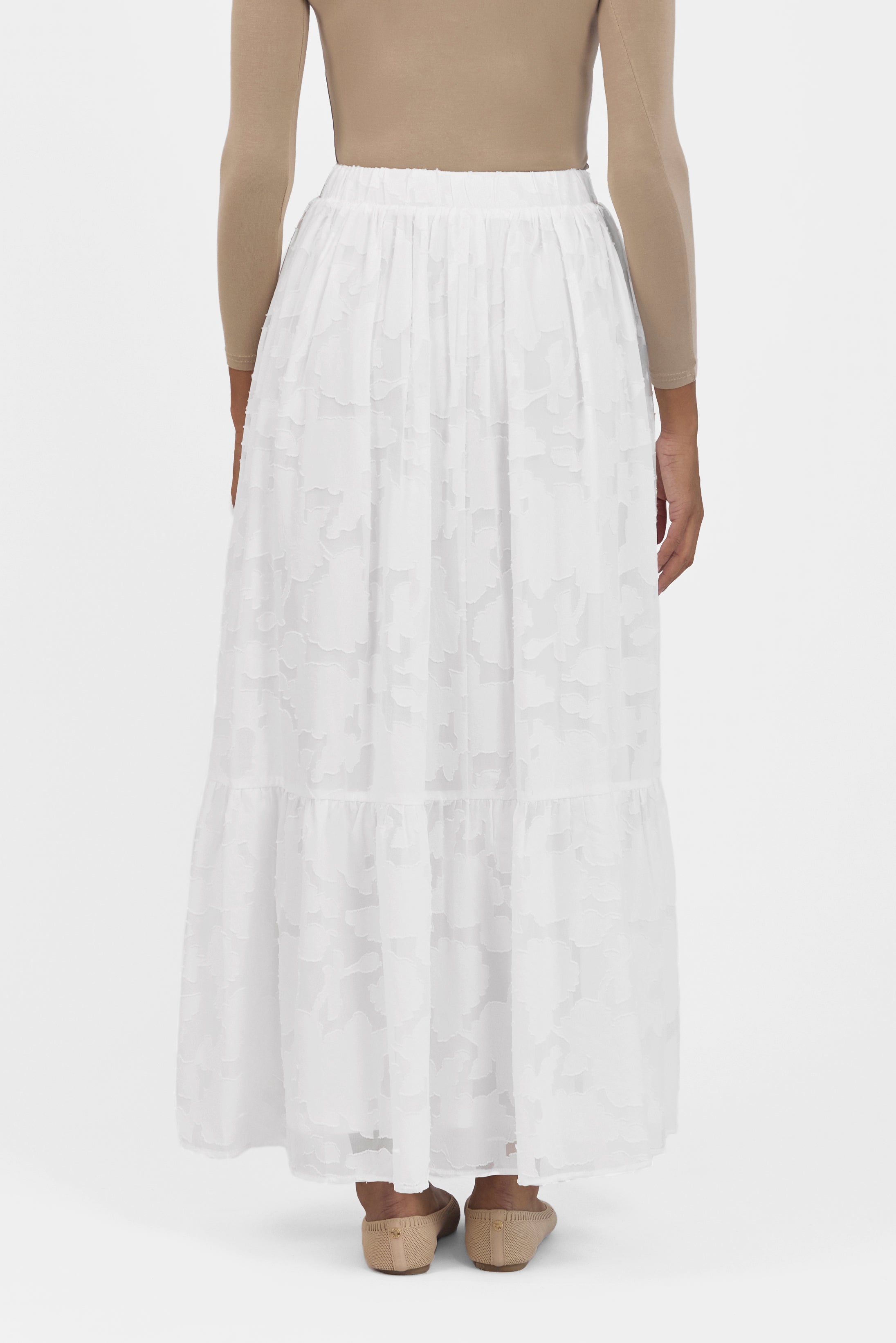 A back view of the skirt from the set. Colour: White