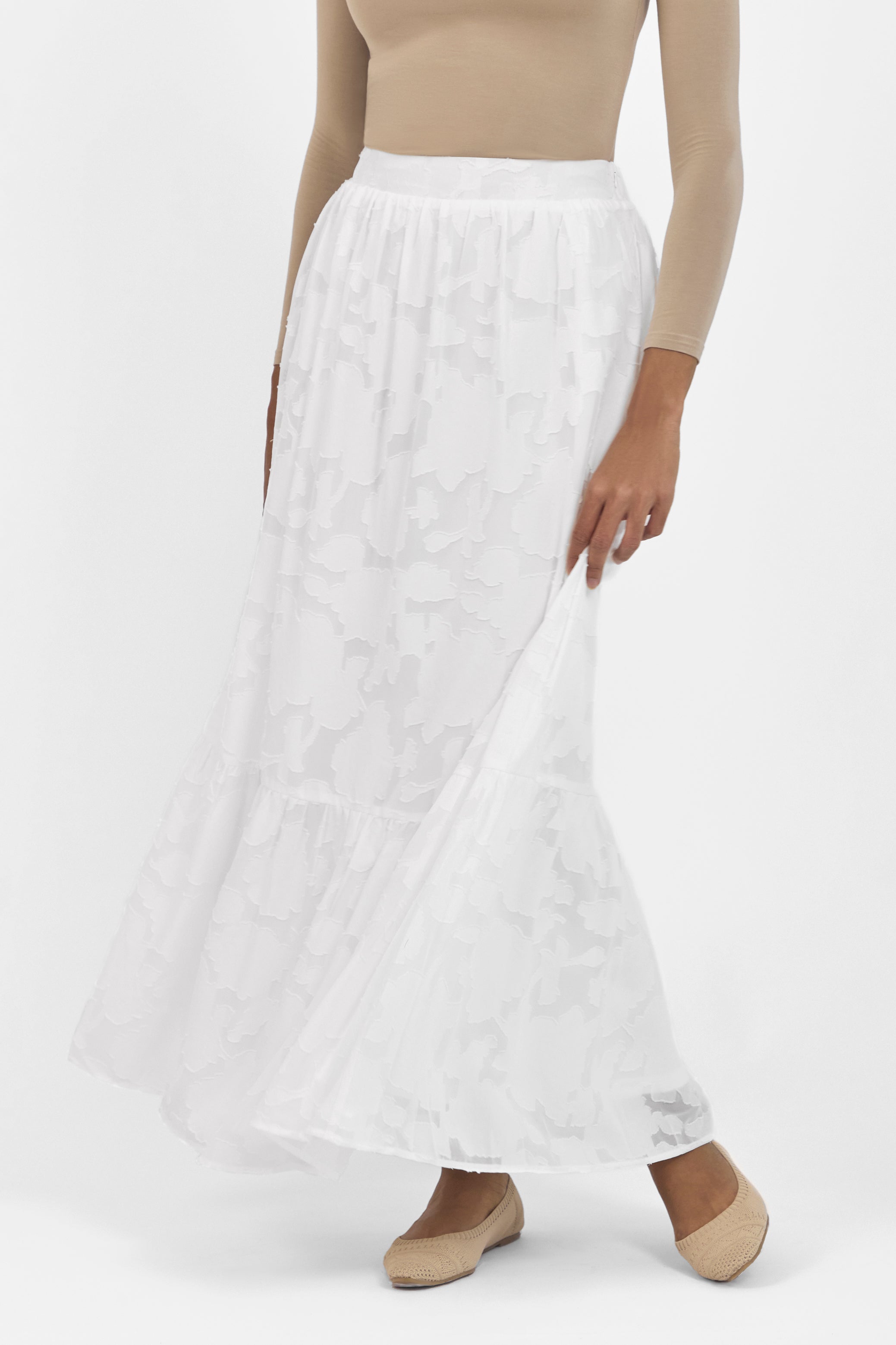 A front view of the skirt from the set. Colour: White