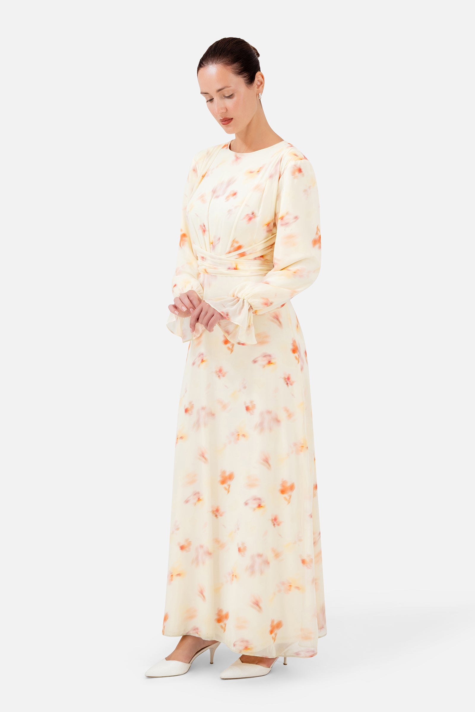 Detailed view of the FARES Waist Wrap Chiffon Dress in Sunbloom, showing the soft chiffon fabric, floral pattern and flattering waist detail.