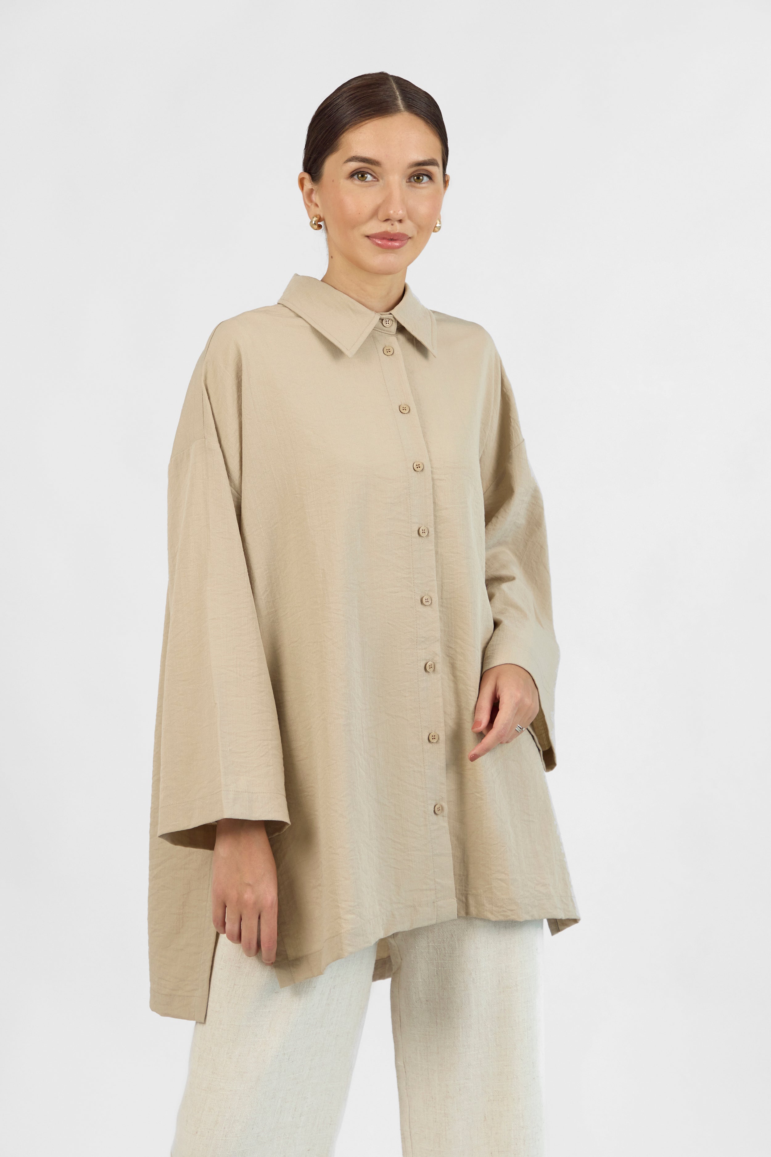 Colour: Sand. A front pose of a model wearing a Wide Sleeve Tunic.