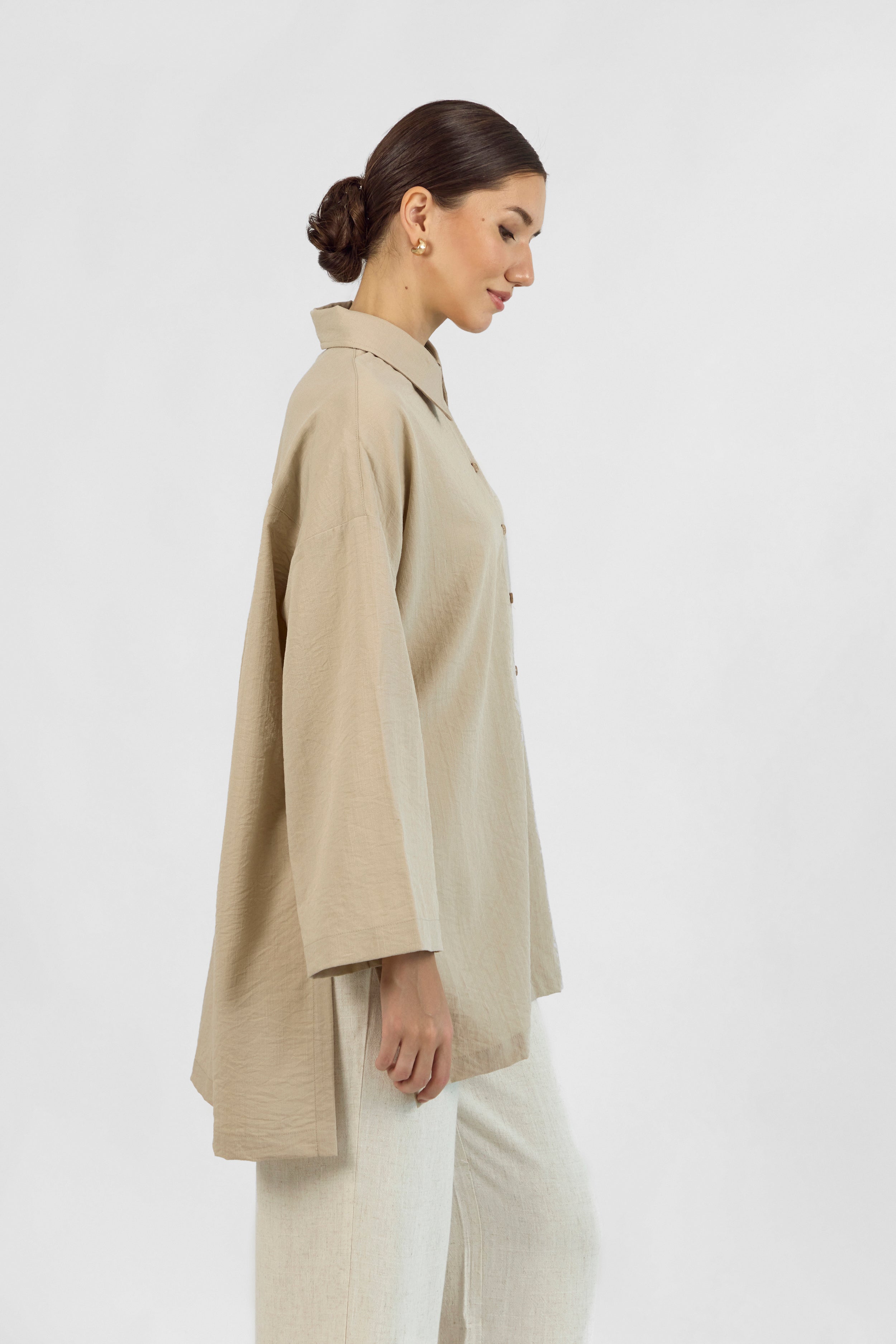 Colour: Sand.A side pose of a girl in Wide Sleeve Tunic