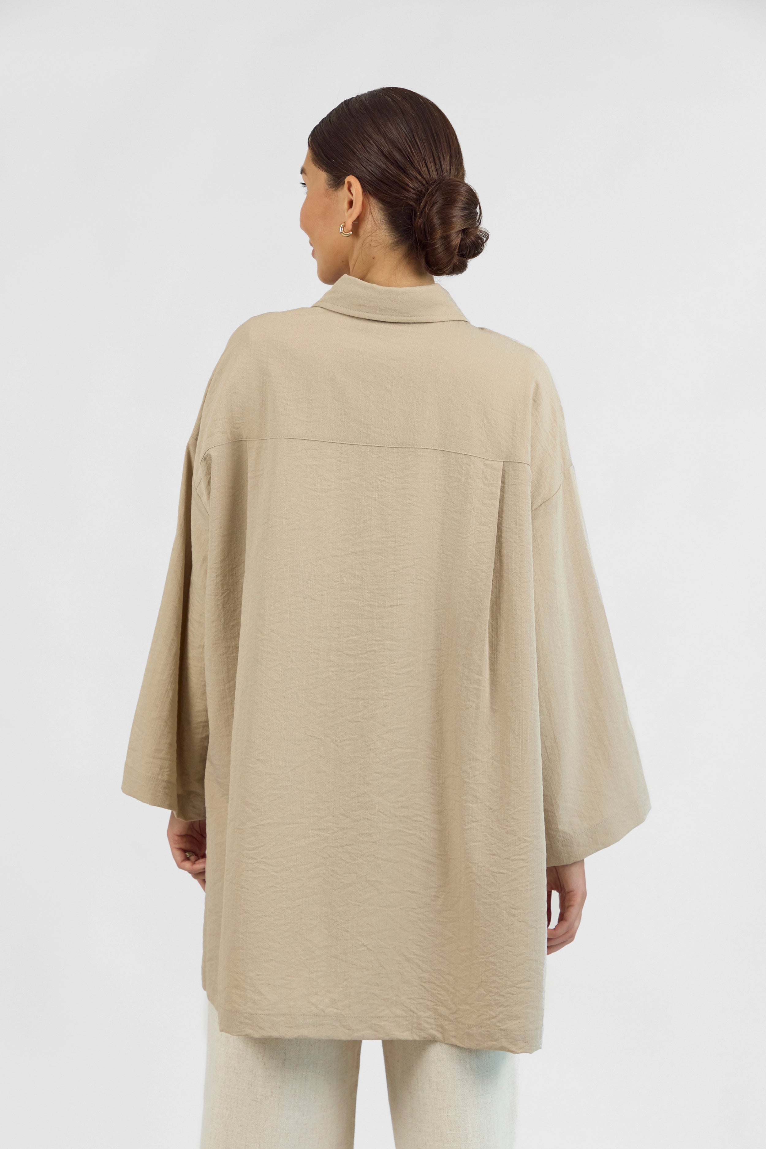 Colour: Sand. A model from behind wearing a Wide Sleeve Tunic