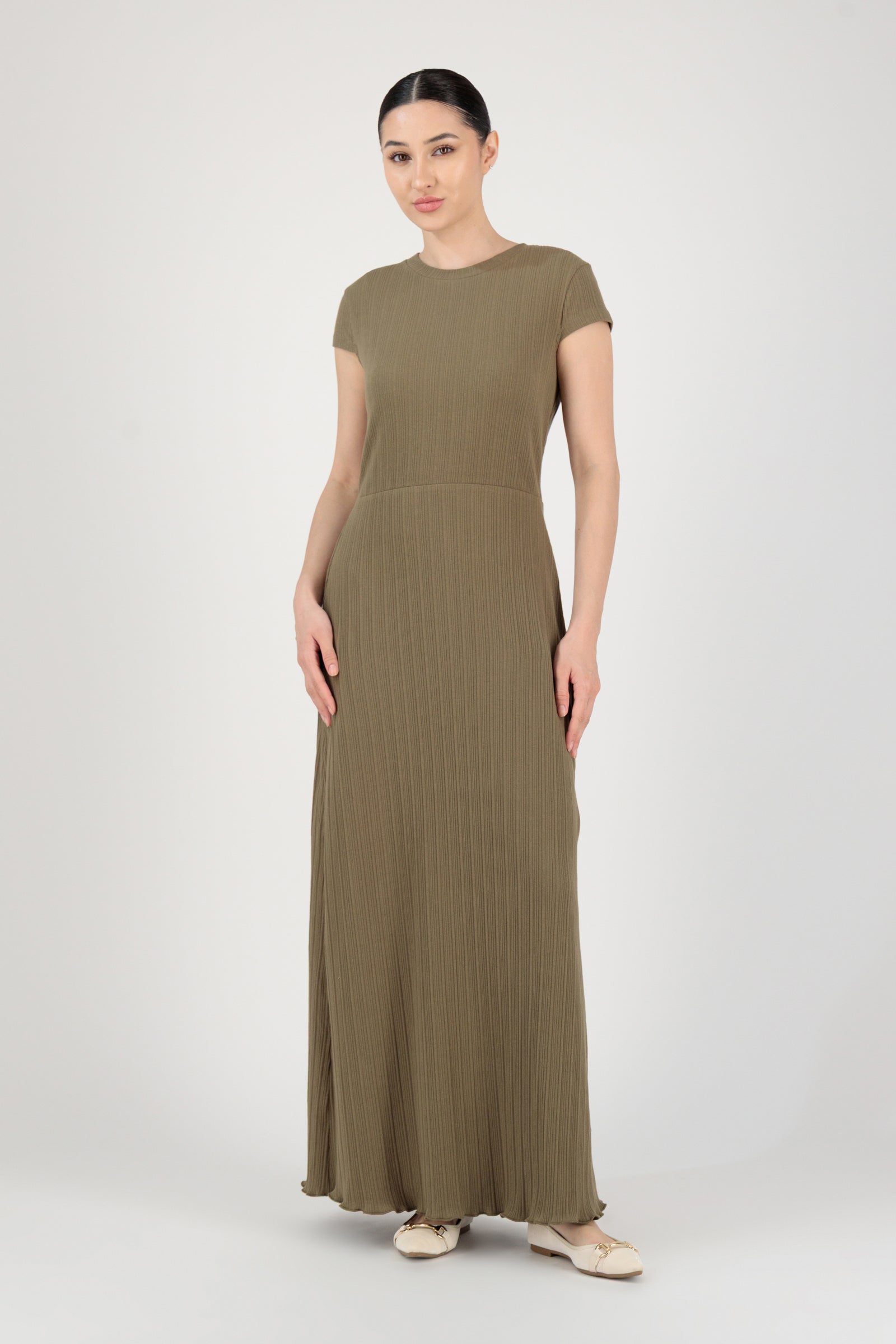 Front view of the FARES Ribbed Cotton Dress in Grove worn alone, presenting a refined long sleeve dress with a relaxed silhouette.