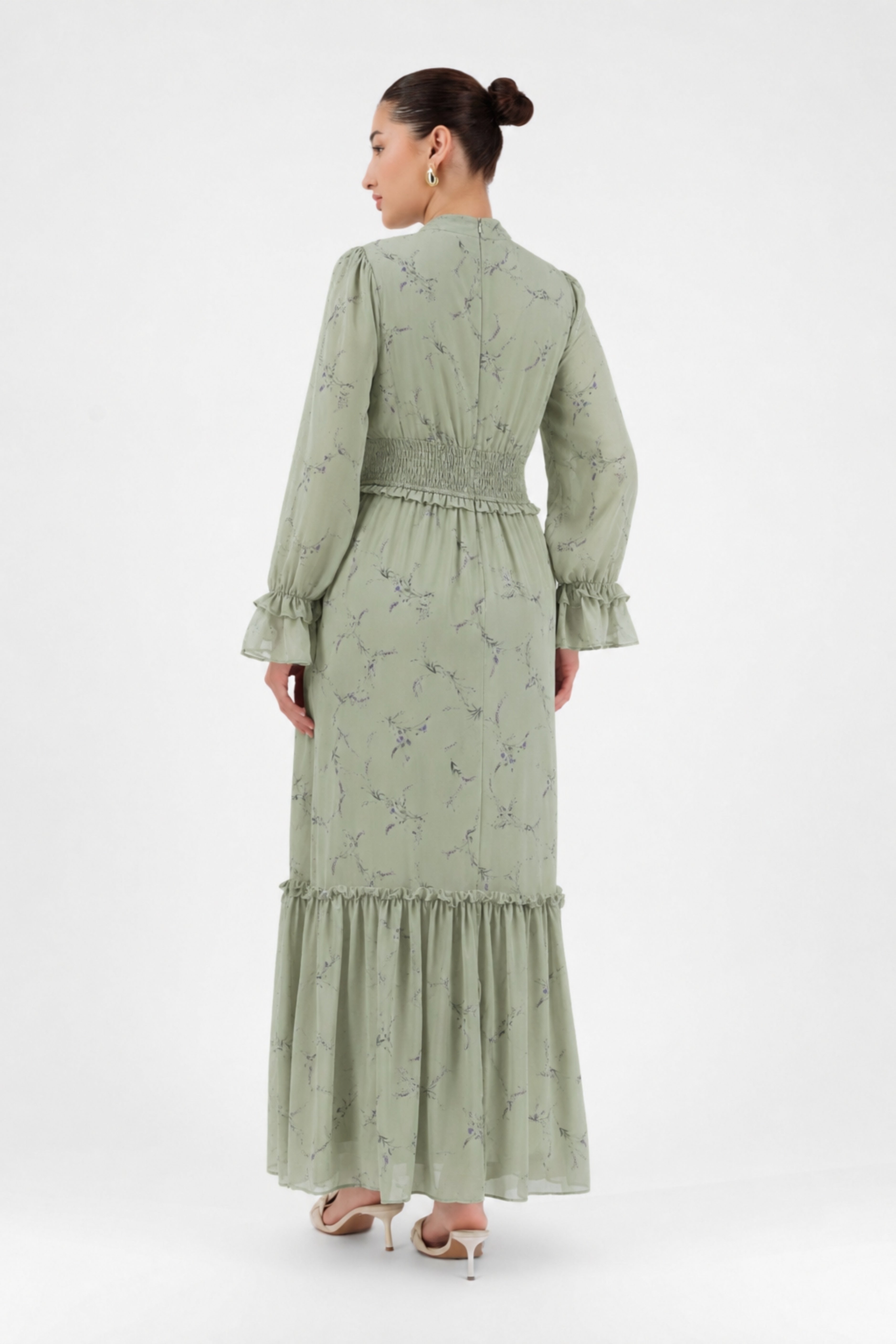 Back view of the Sage Meadow maxi dress showcasing the delicate print and tiered skirt.